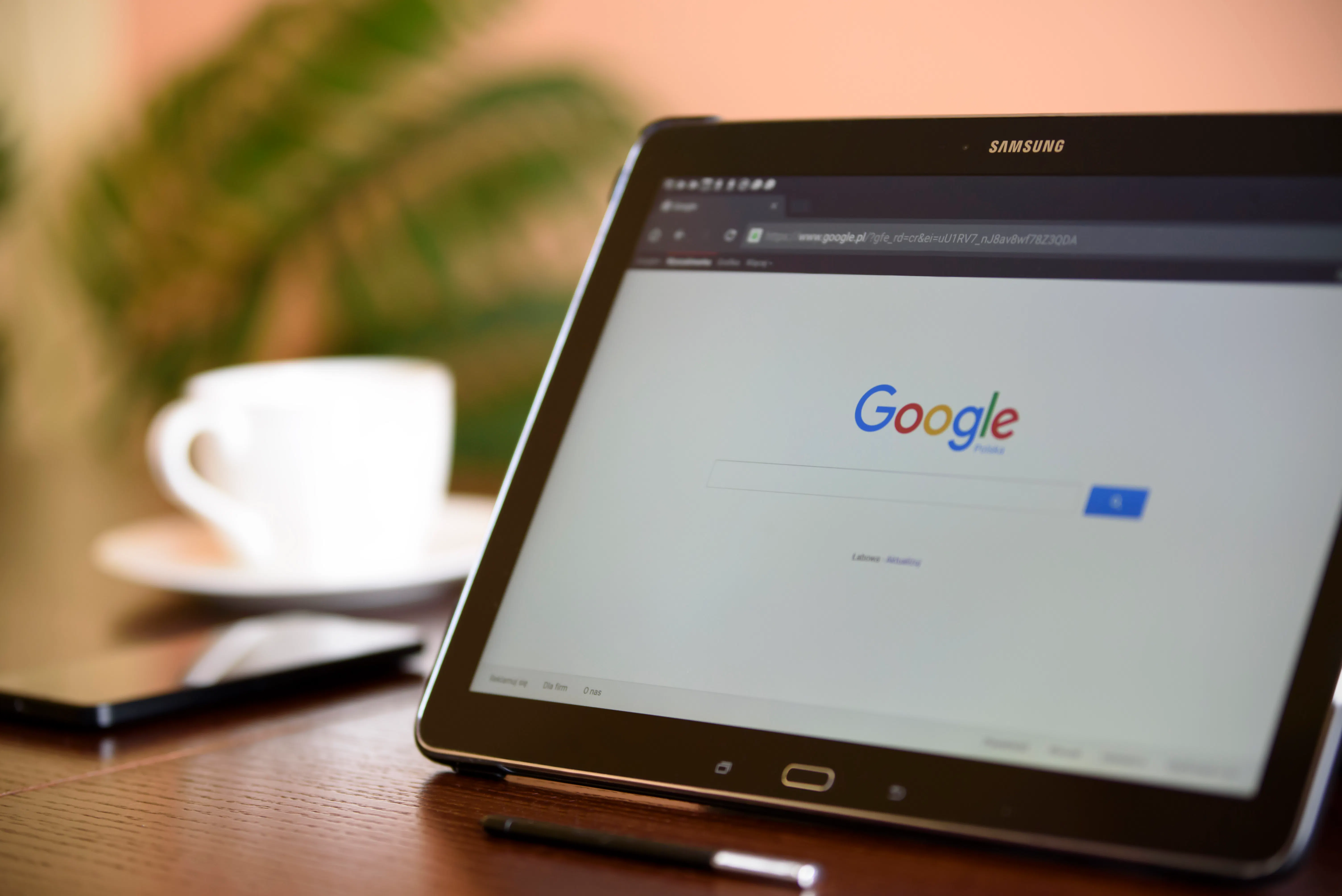 A tablet displaying the Google search engine homepage, illustrating the importance of search engine optimization for content creation and blog traffic.