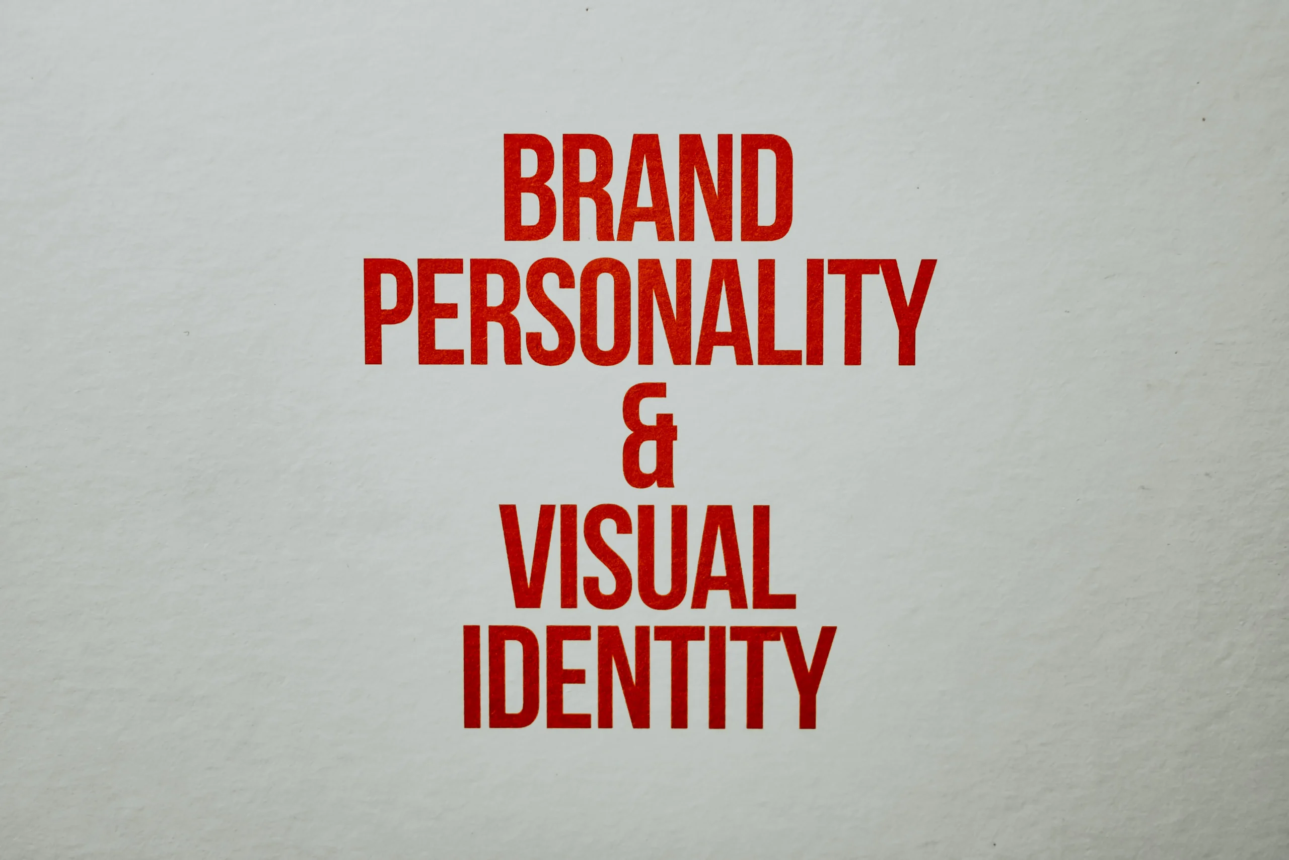 The words 'Brand Personality & Visual Identity' in red letters, highlighting the importance of branding when creating content with an AI blog writer and focusing on SEO blog writing.