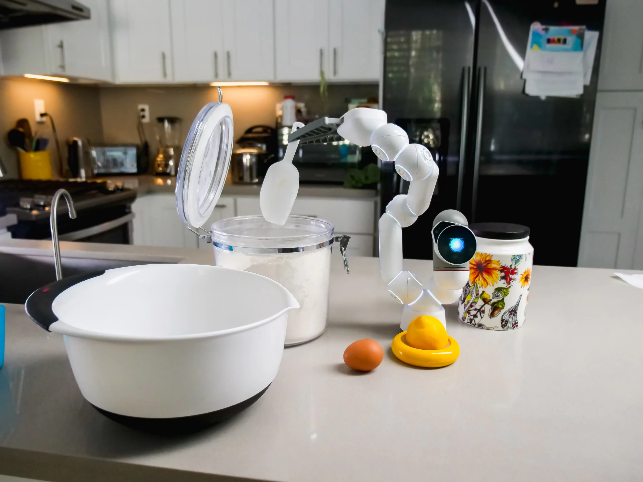 A robotic arm assisting in a kitchen setting, possibly automating cooking tasks, demonstrating AI's potential in content creation and daily life.