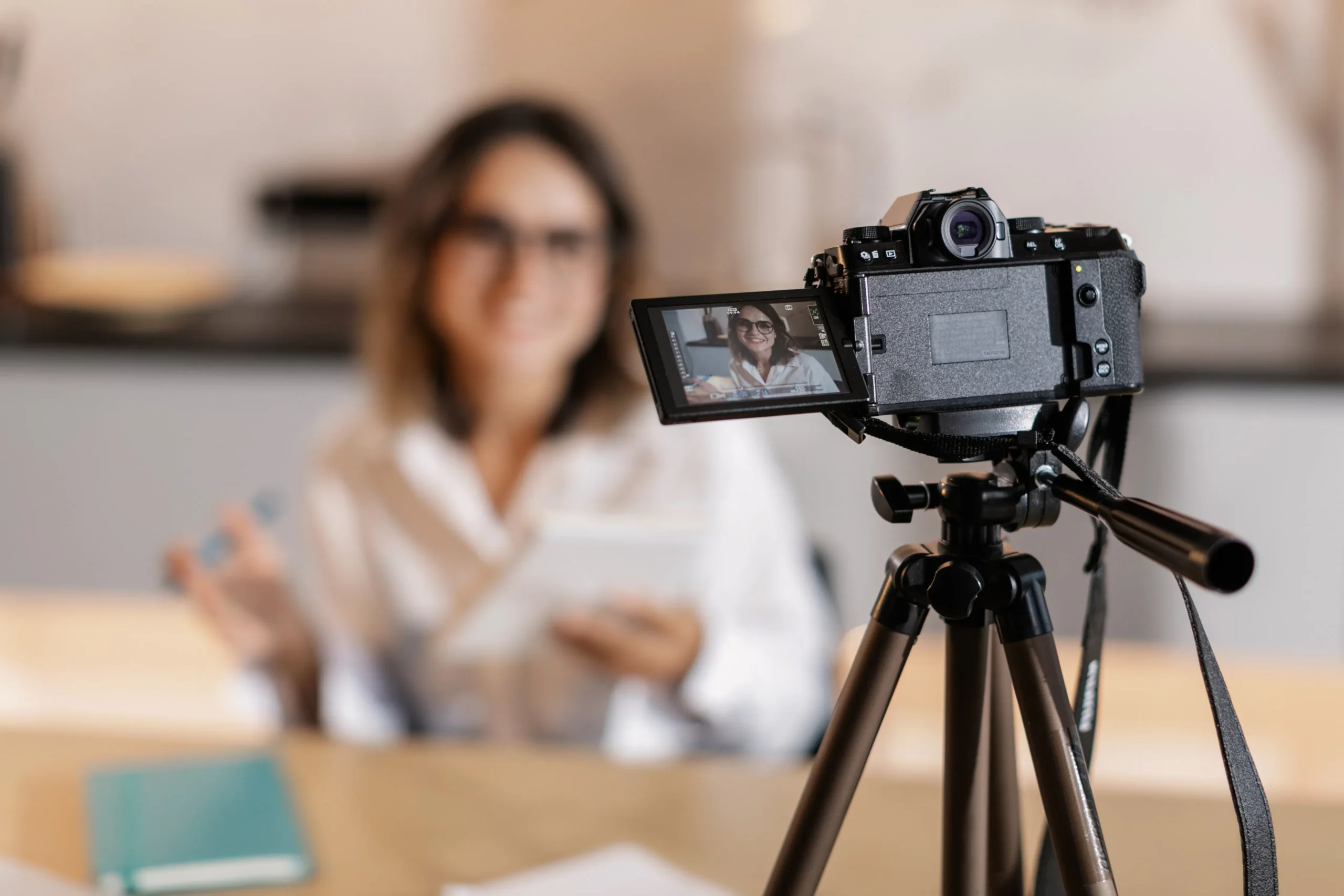 Camera recording woman for social media content creation, influencer marketing.