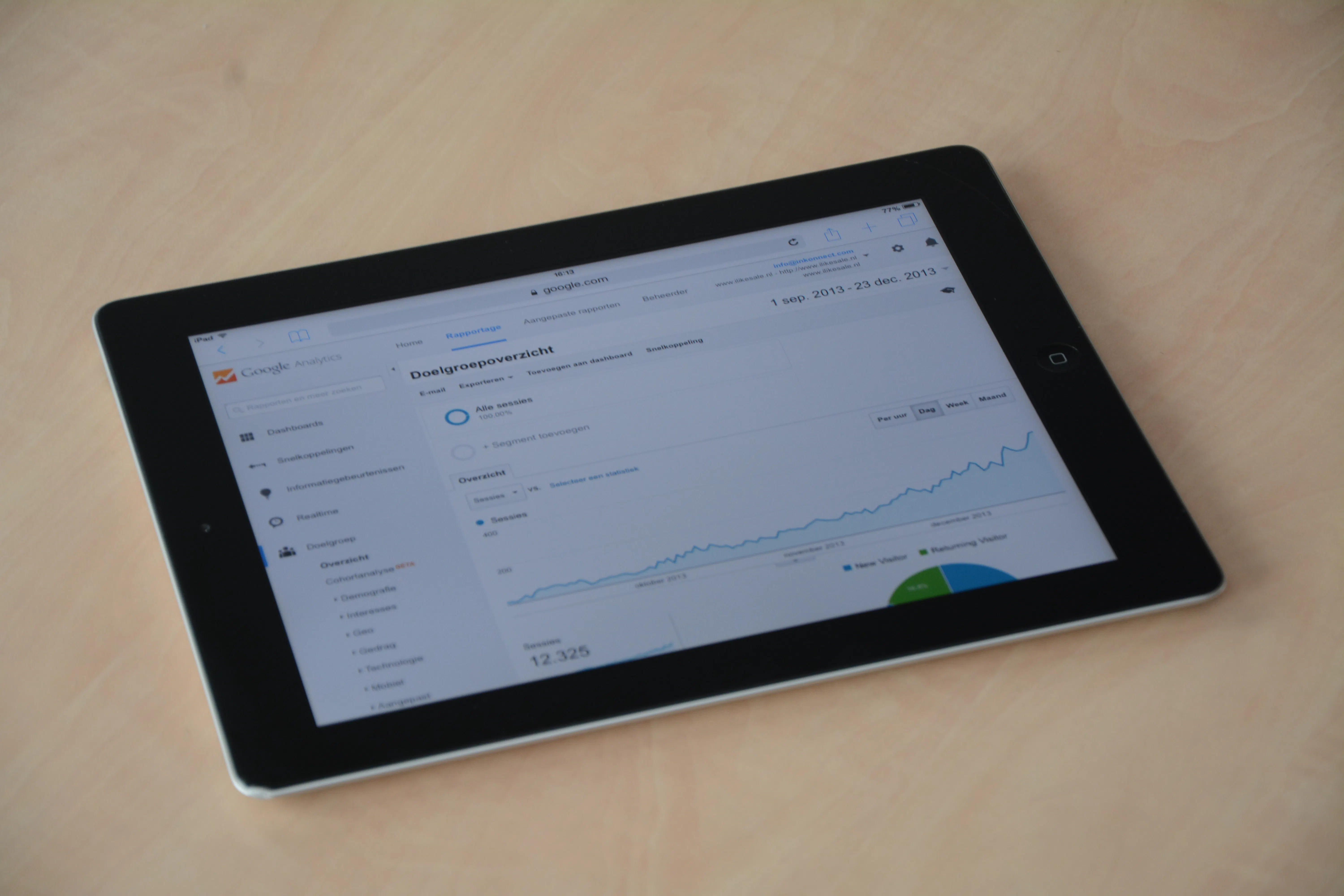 A tablet displaying analytics data to help optimize content for AI search engines through AEO SEO.