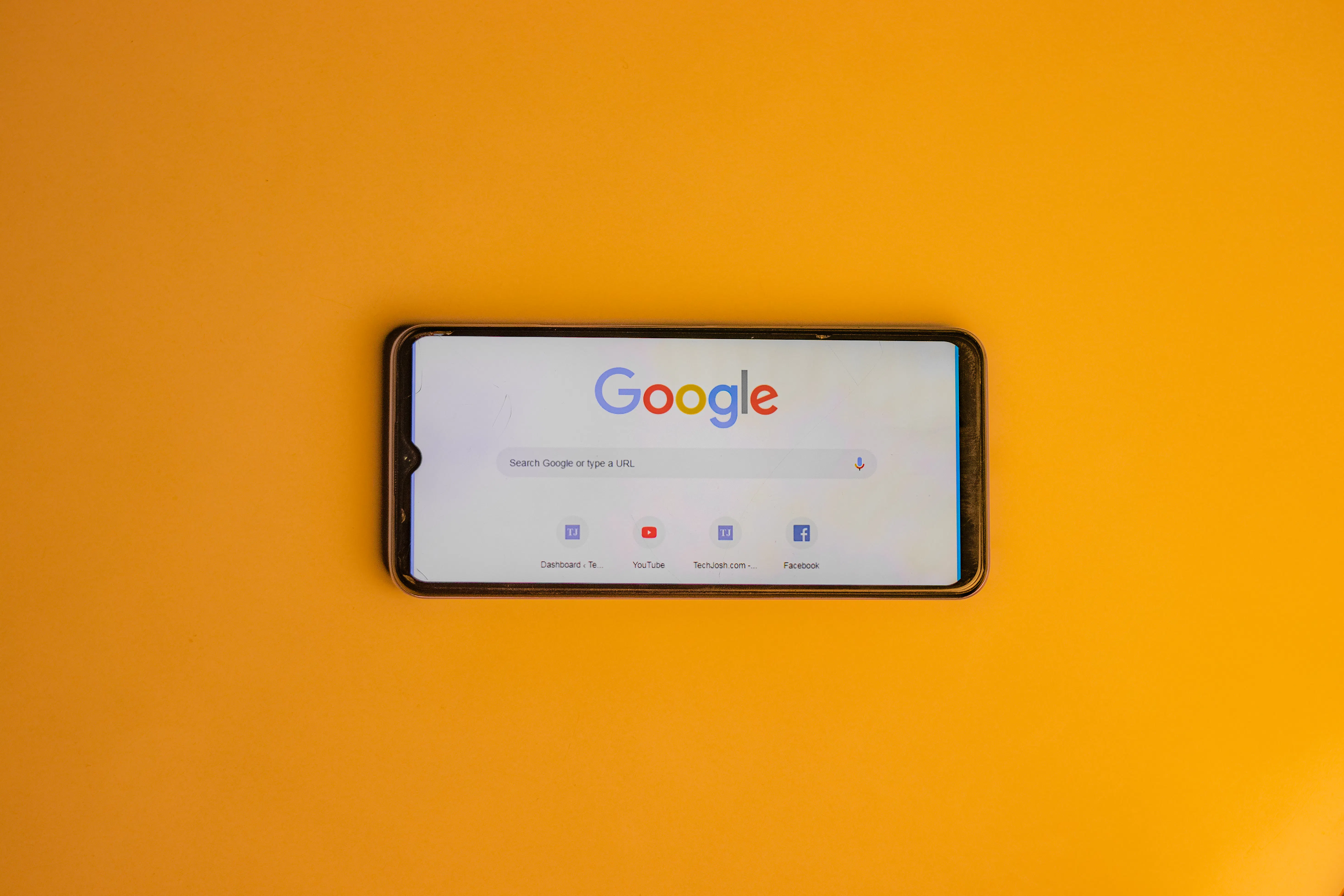 Smartphone showing Google search, useful for finding the best ai content generator tools.