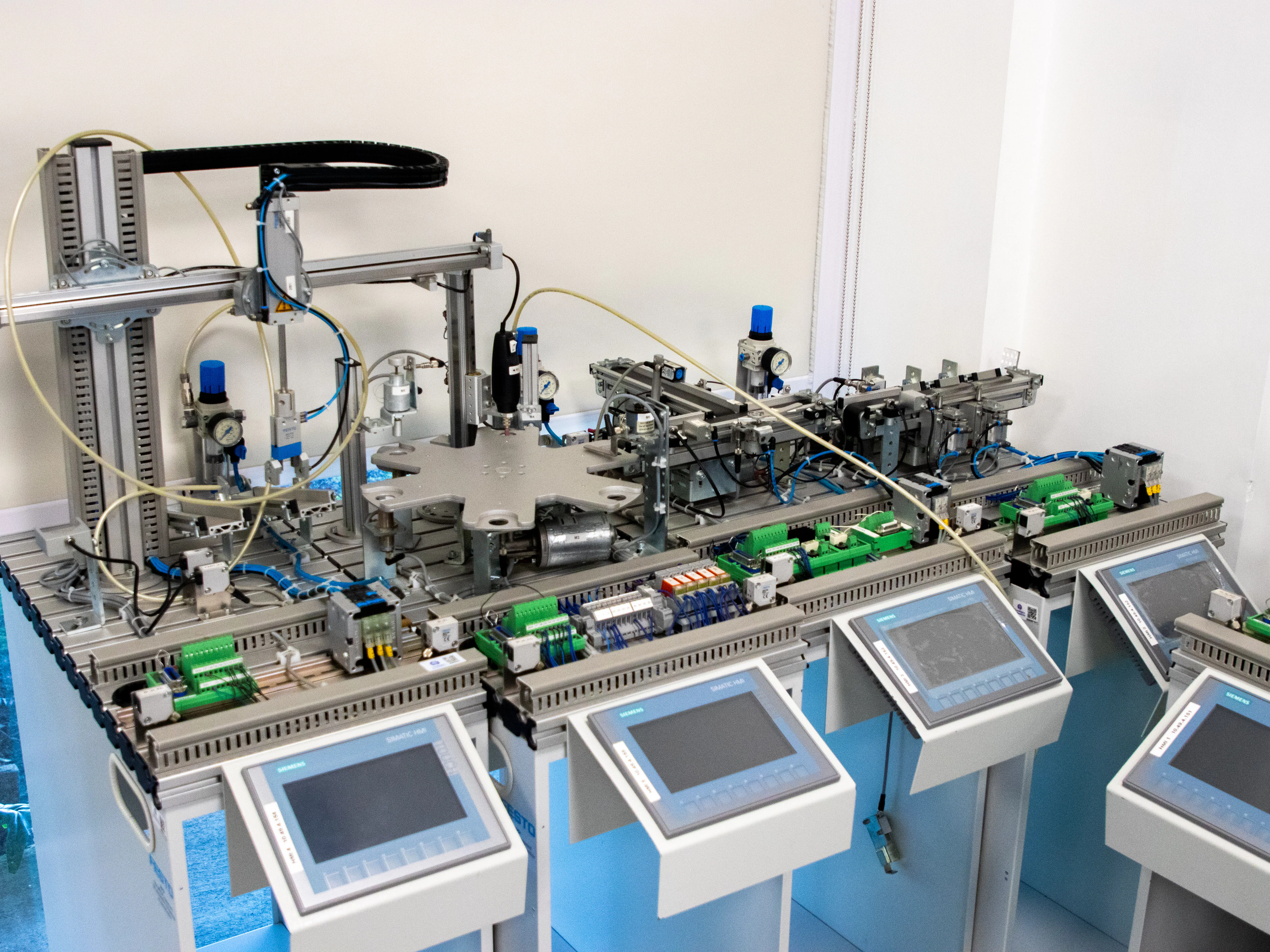 Industrial automation equipment with screens, symbolizing an automated blog workflow and efficiency.