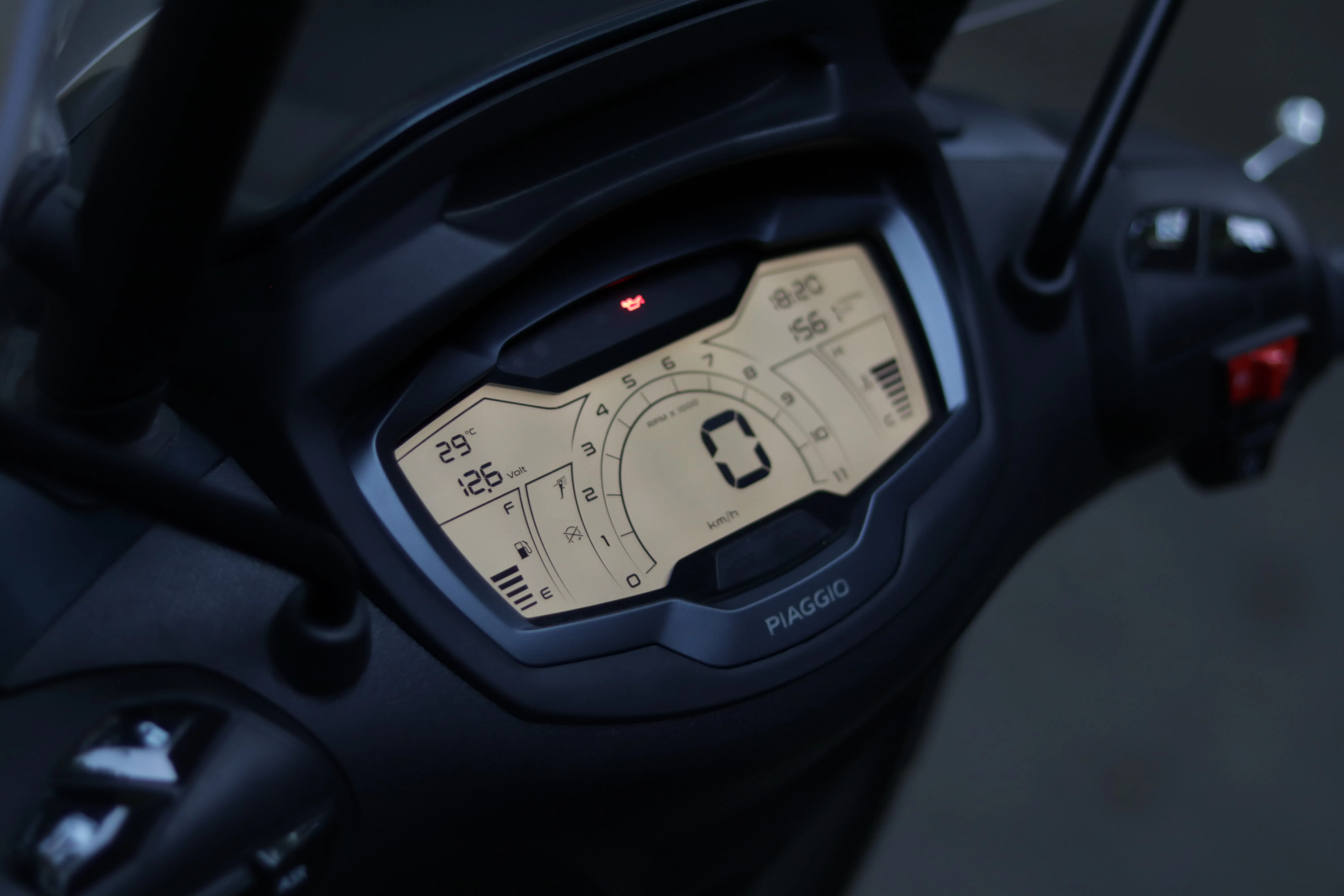 Digital dashboard of a Piaggio scooter, analyzed by an AI blog generator.
