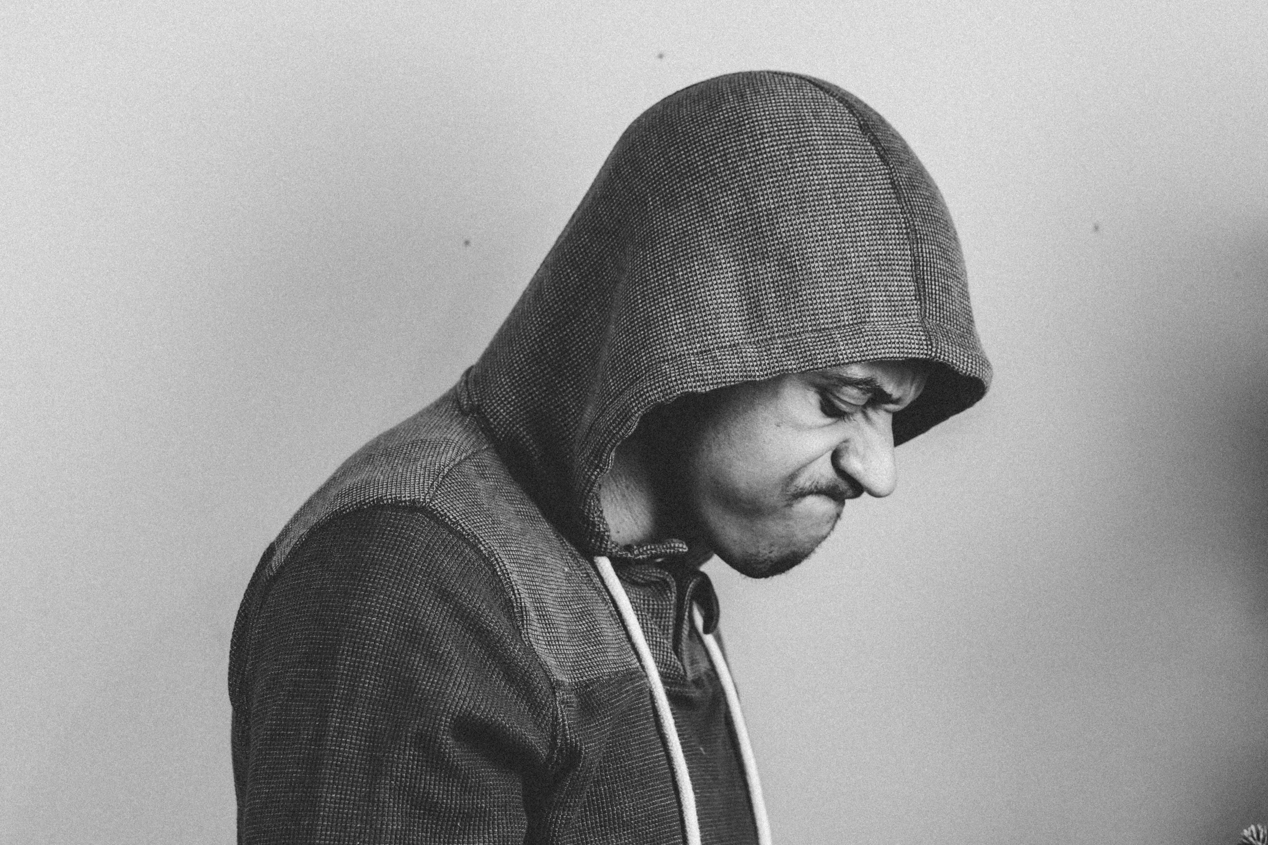 A frustrated person in a hoodie, illustrating common AI writing pitfalls and SEO mistakes to avoid.