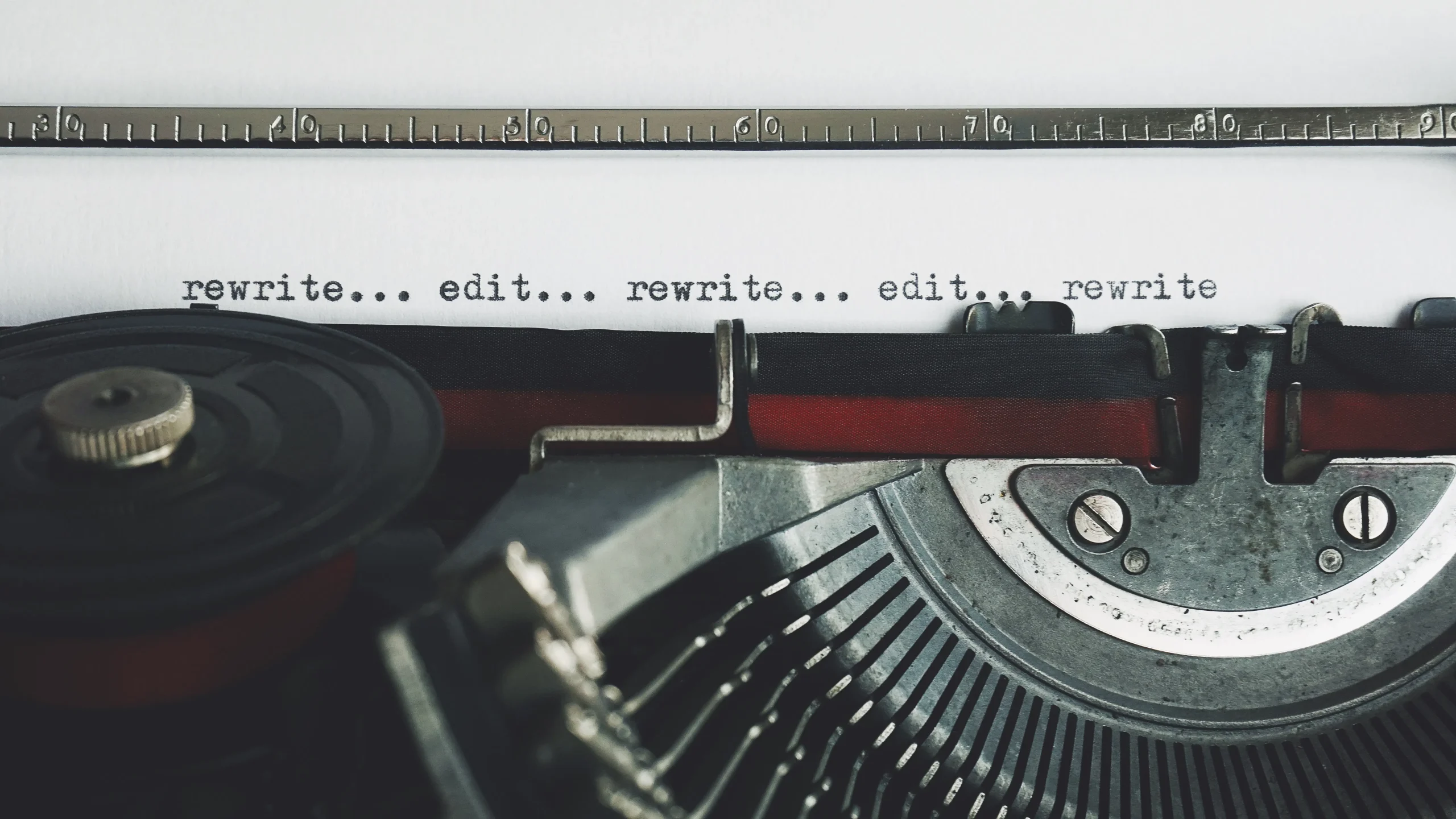 Typewriter text says rewrite and edit, showing why teams need an AI writing assistant for marketers.