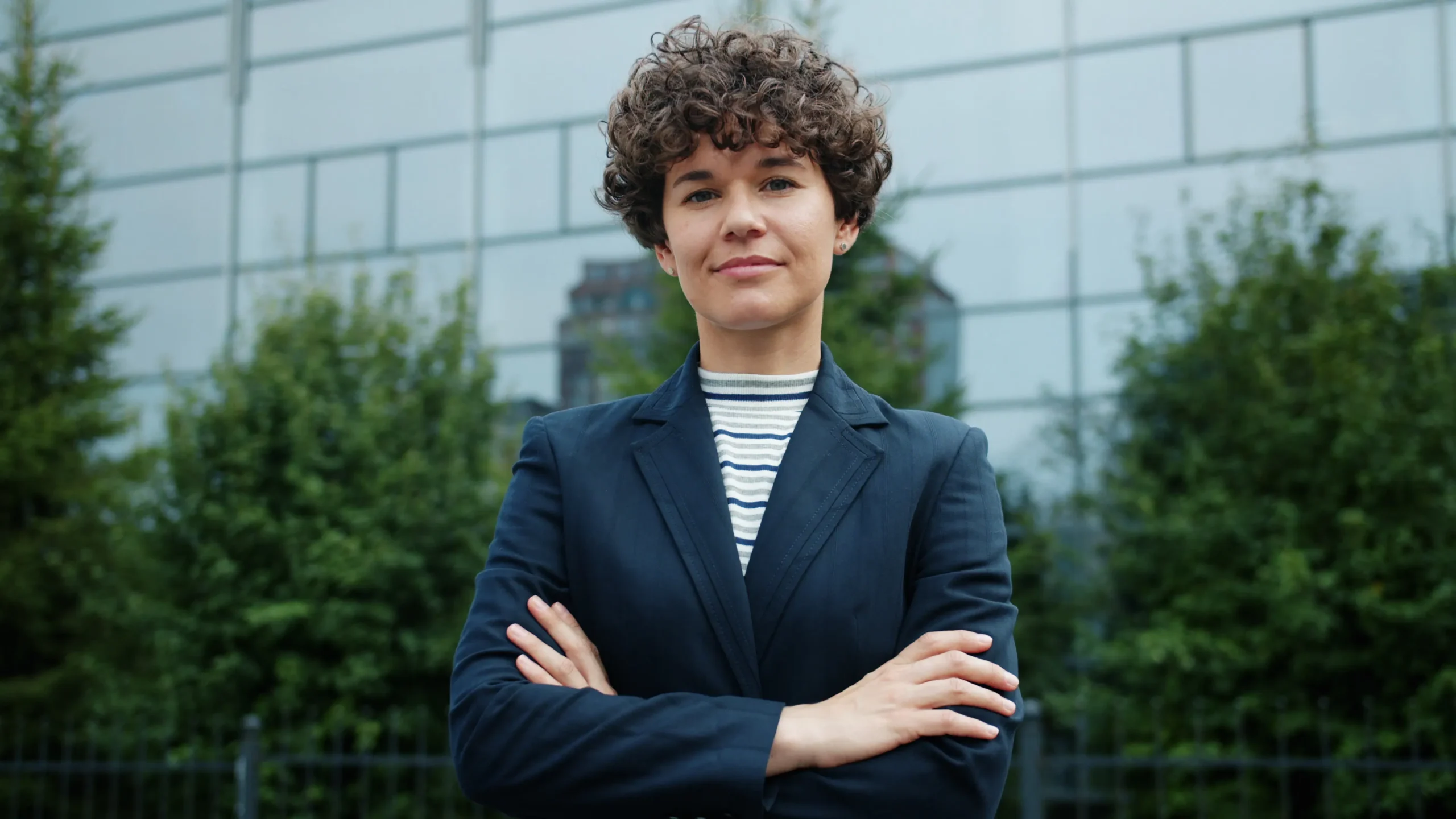 Professional woman using an automated blog post creator for quality control.