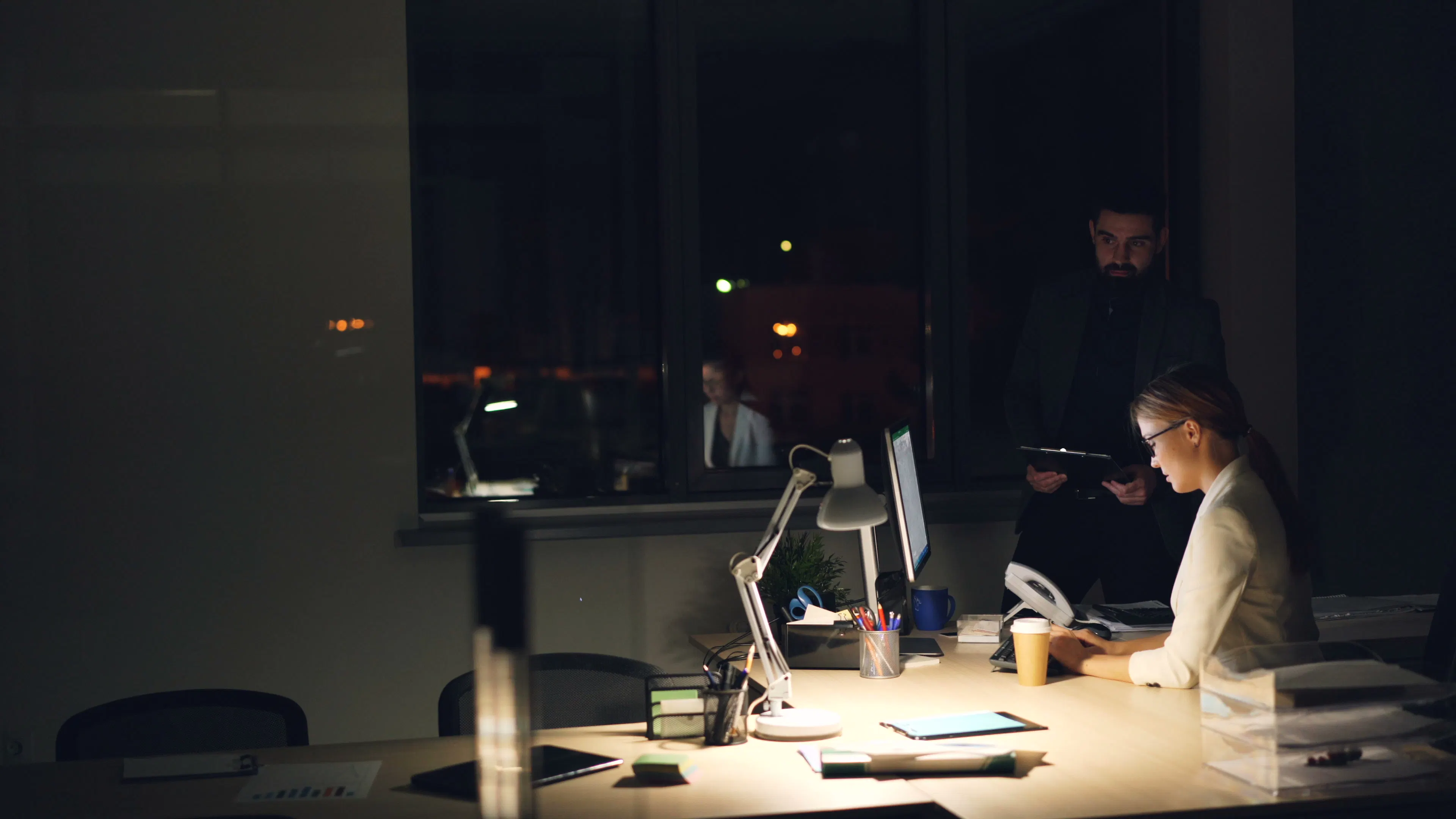 Team working late on an ai content strategy to boost seo content production and scaling blog content.