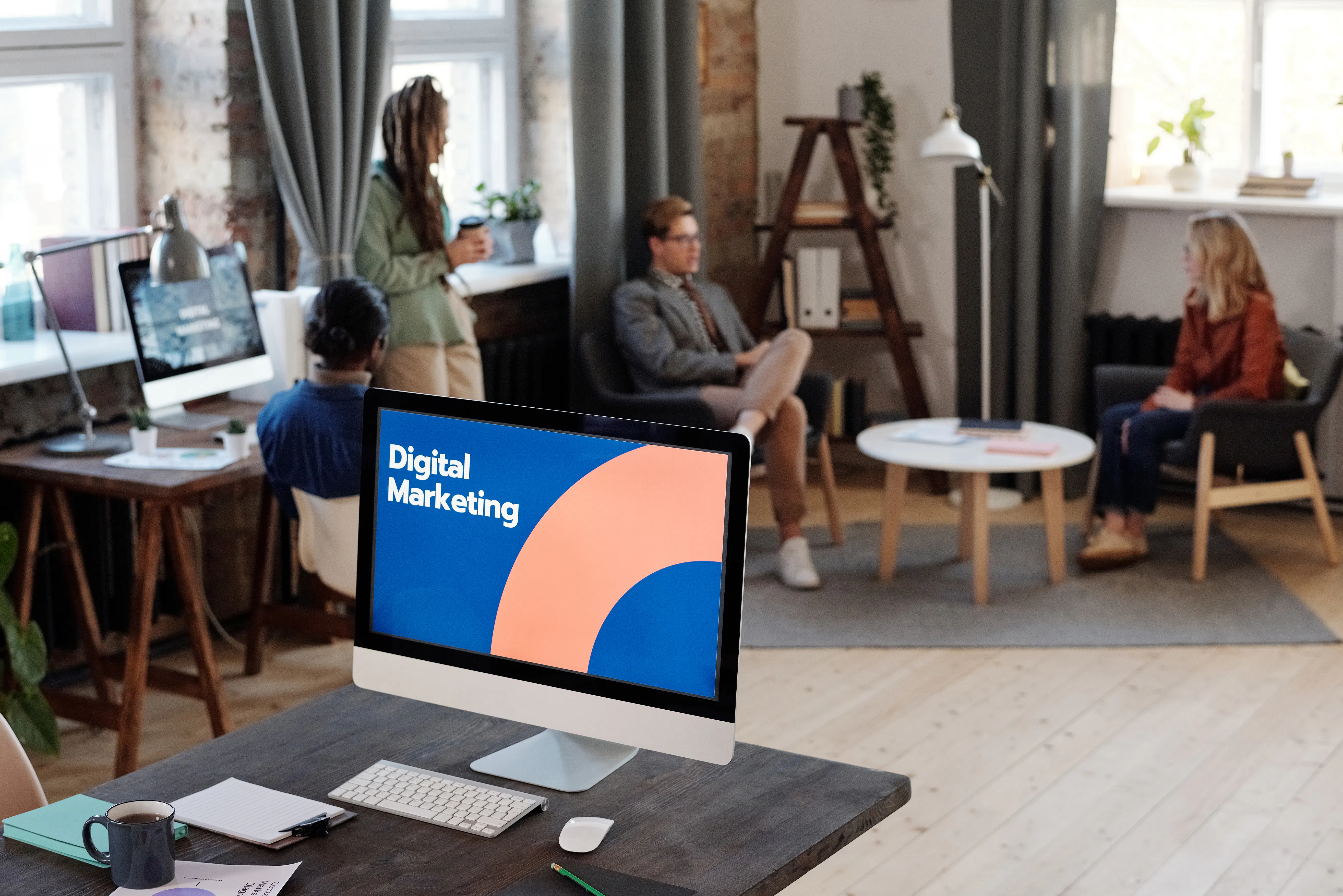 Modern office workspace showing a computer screen with digital marketing and AI search engine optimization.