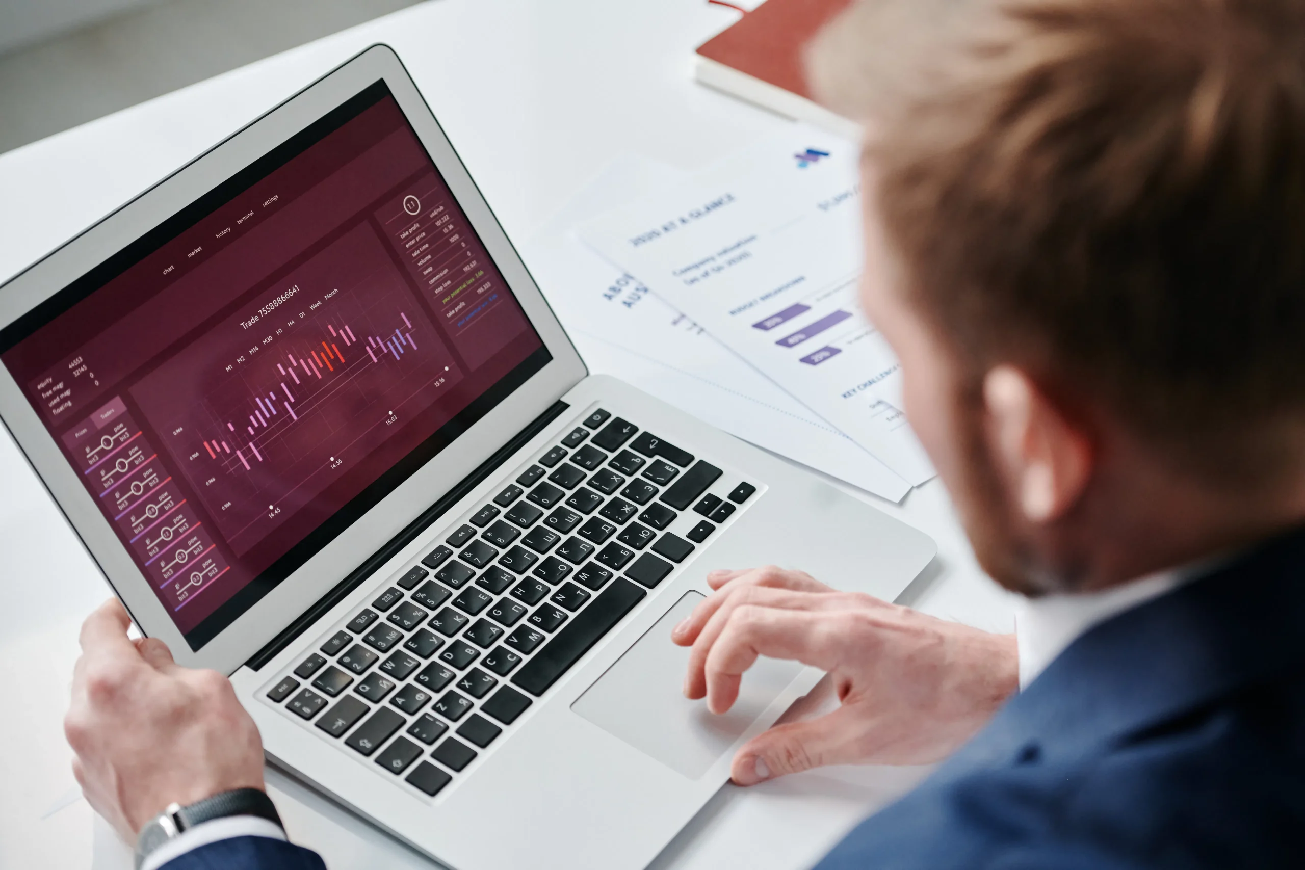Professional using a laptop for data analysis, relevant to an ai seo article writer.