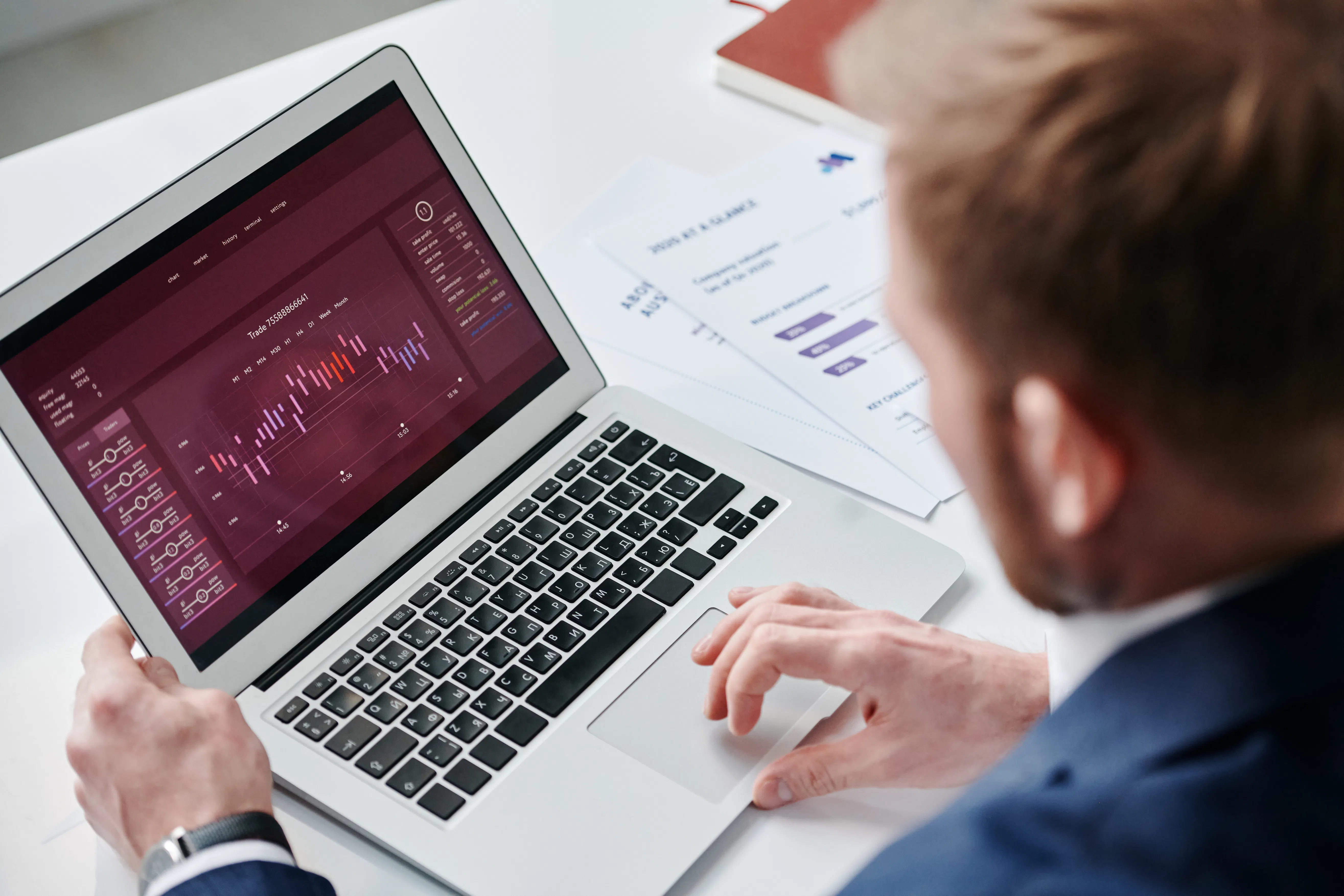 A professional working on a laptop to optimize content for AI search and improve rankings.
