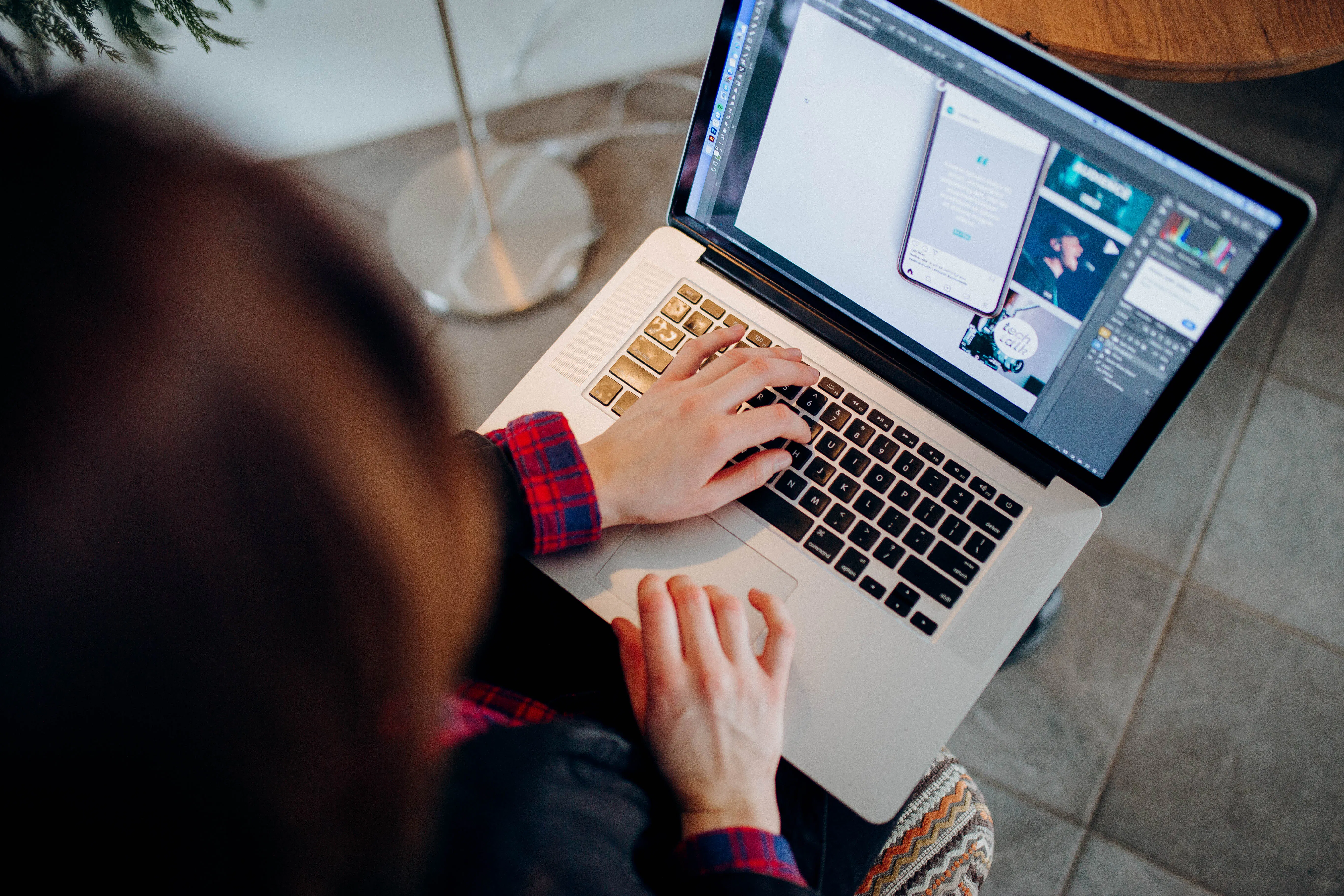 Person using an ai content writing tool to humanize ai content on a laptop.