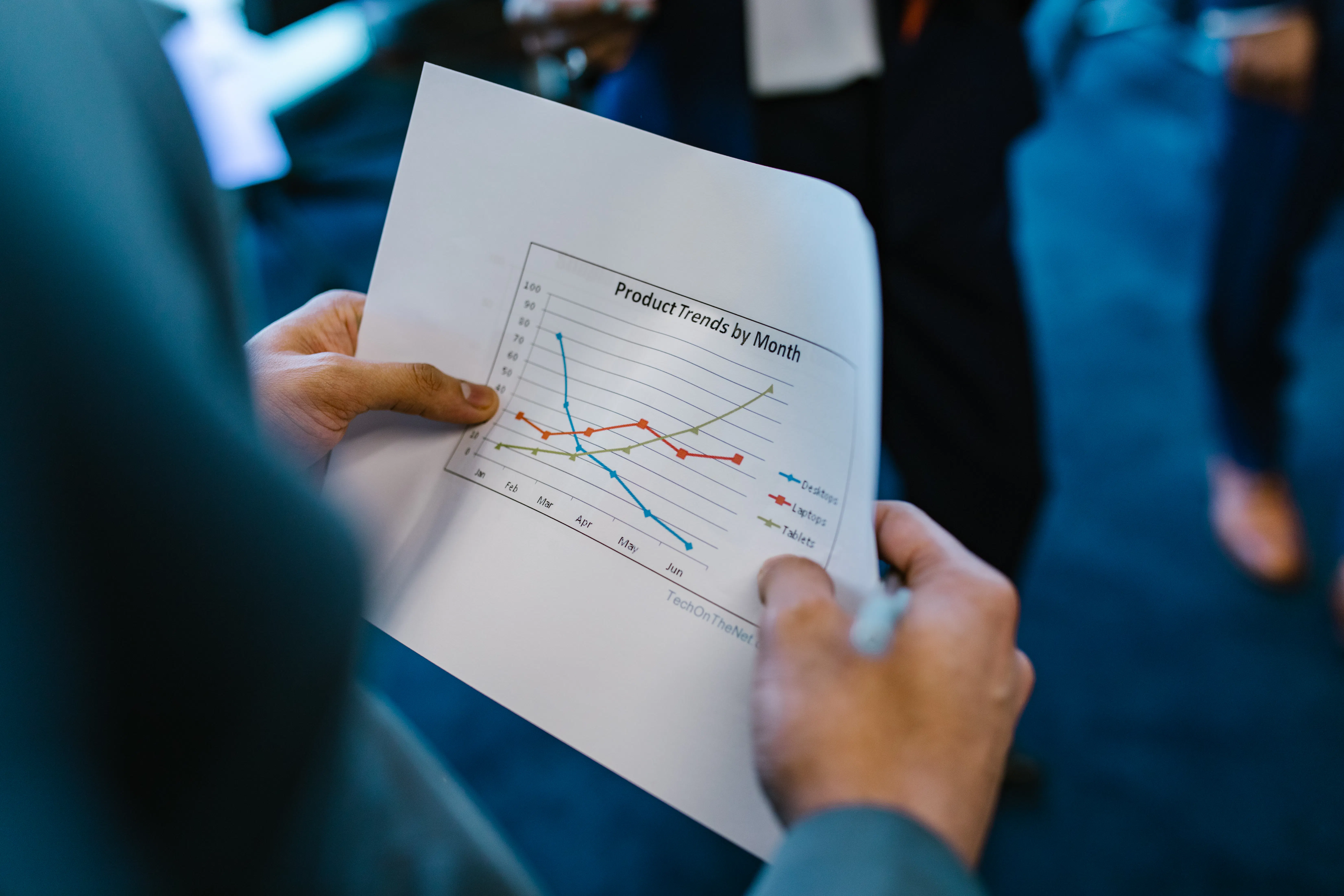 Business professional reviewing a chart to analyze the ROI of an AI seo article writer.