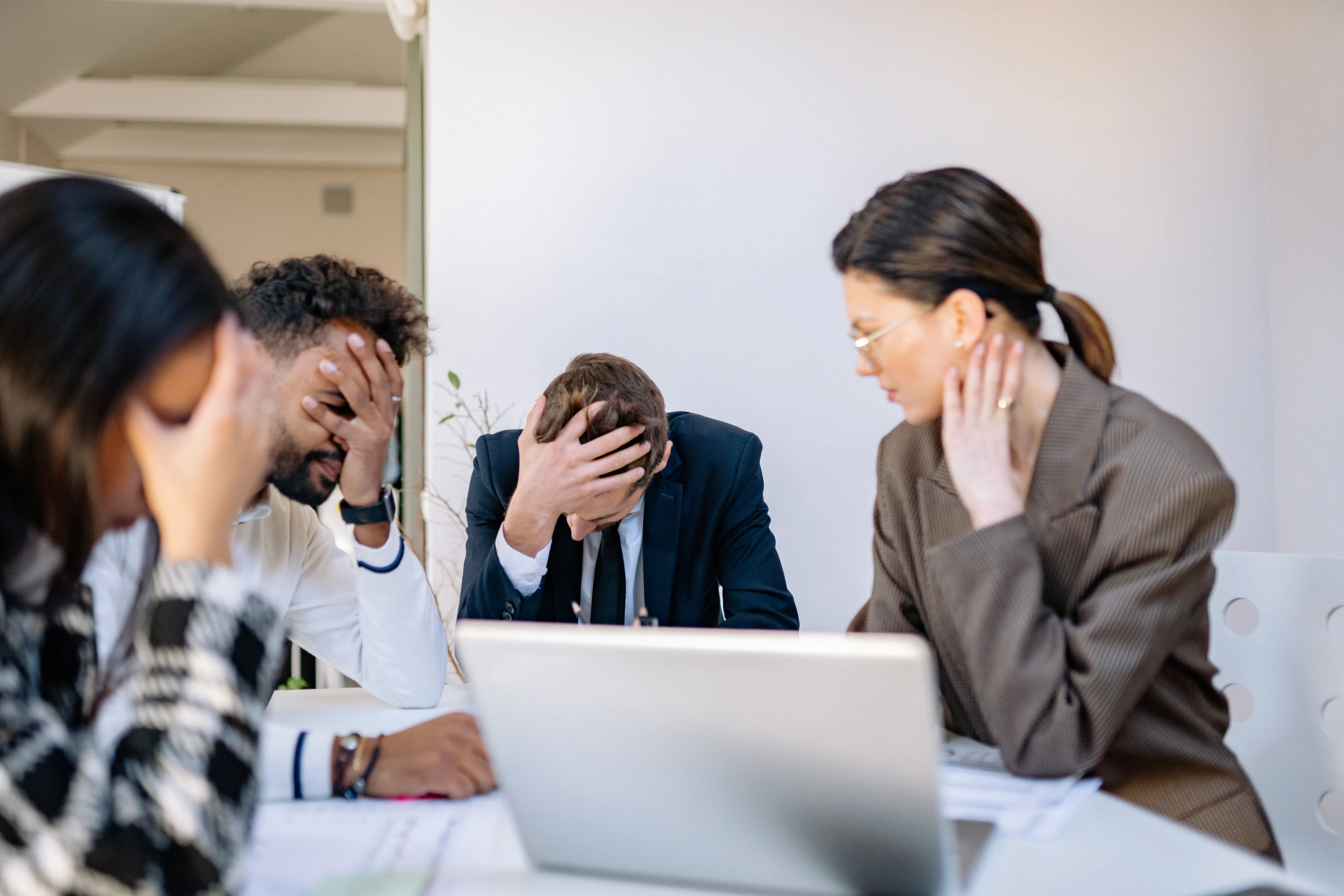 Stressed team struggling with poor SEO software ROI and marketing automation software failures.