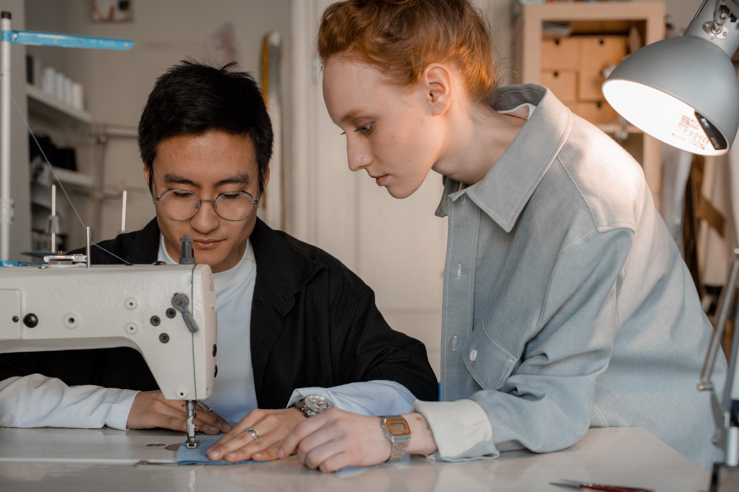 Two people working together, representing the collaboration of human writers vs AI in content creation.