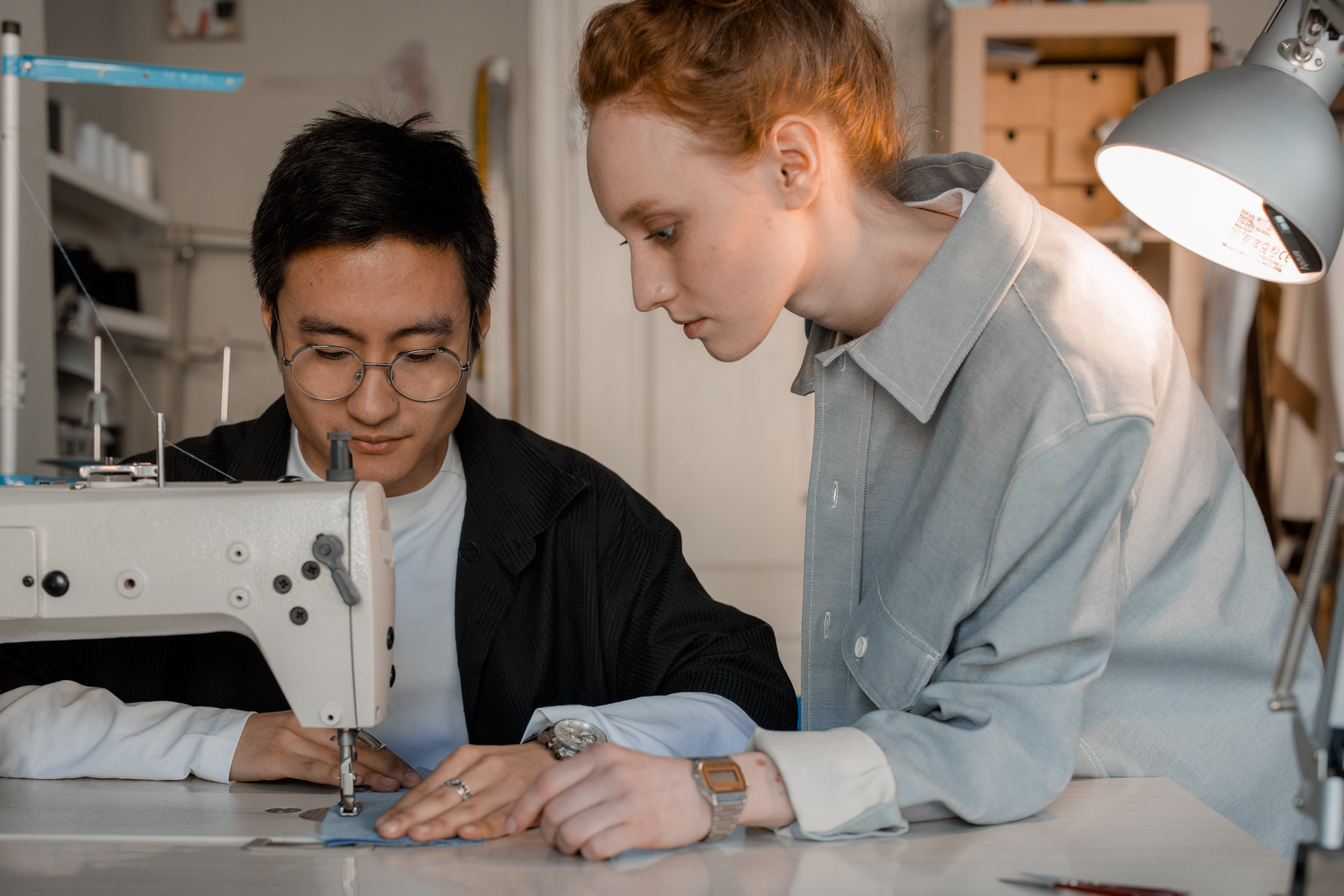 Two people working together, representing the collaboration of human writers vs AI in content creation.