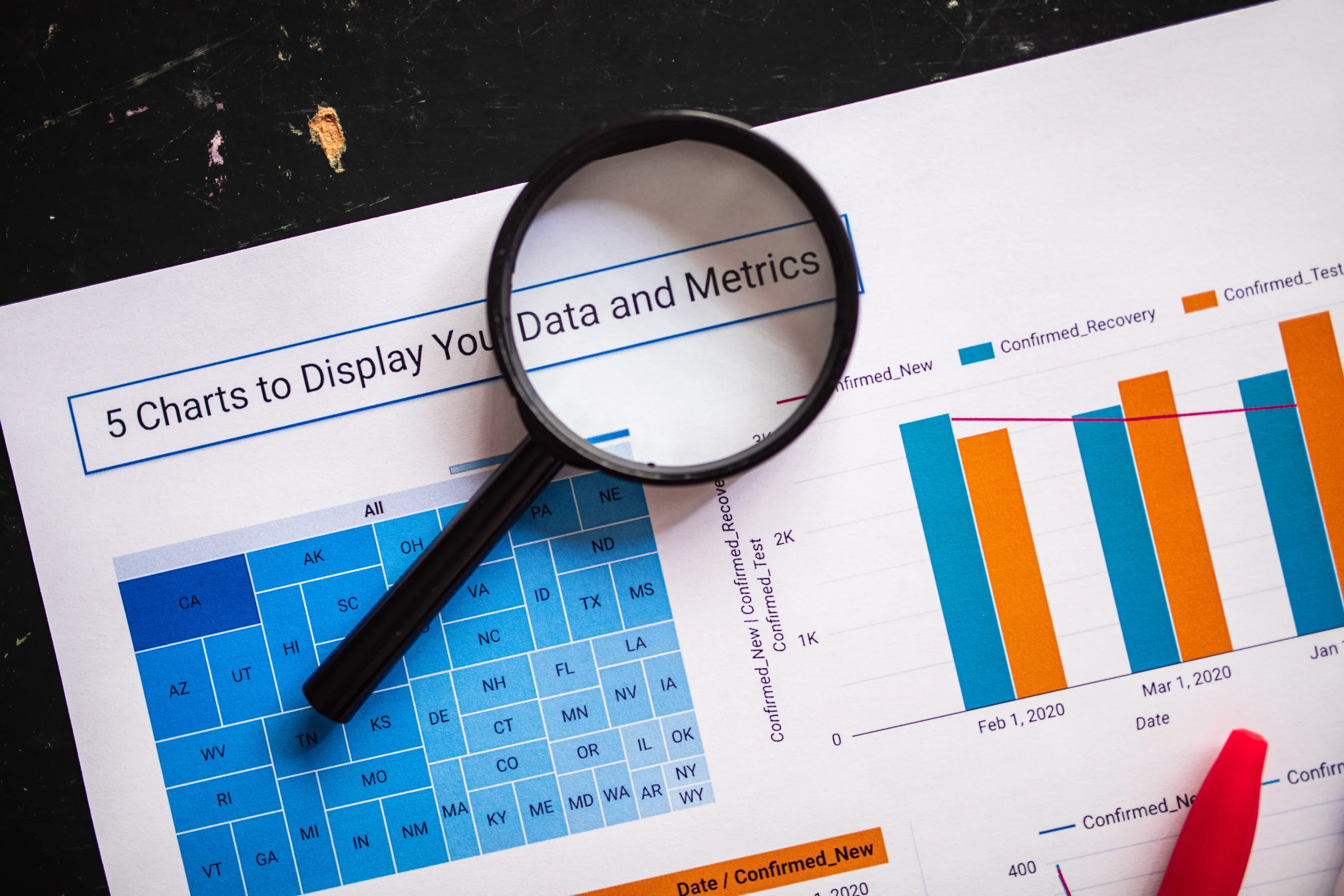 A magnifying glass over data charts, essential for blog quality control in automated blog post creator tools.