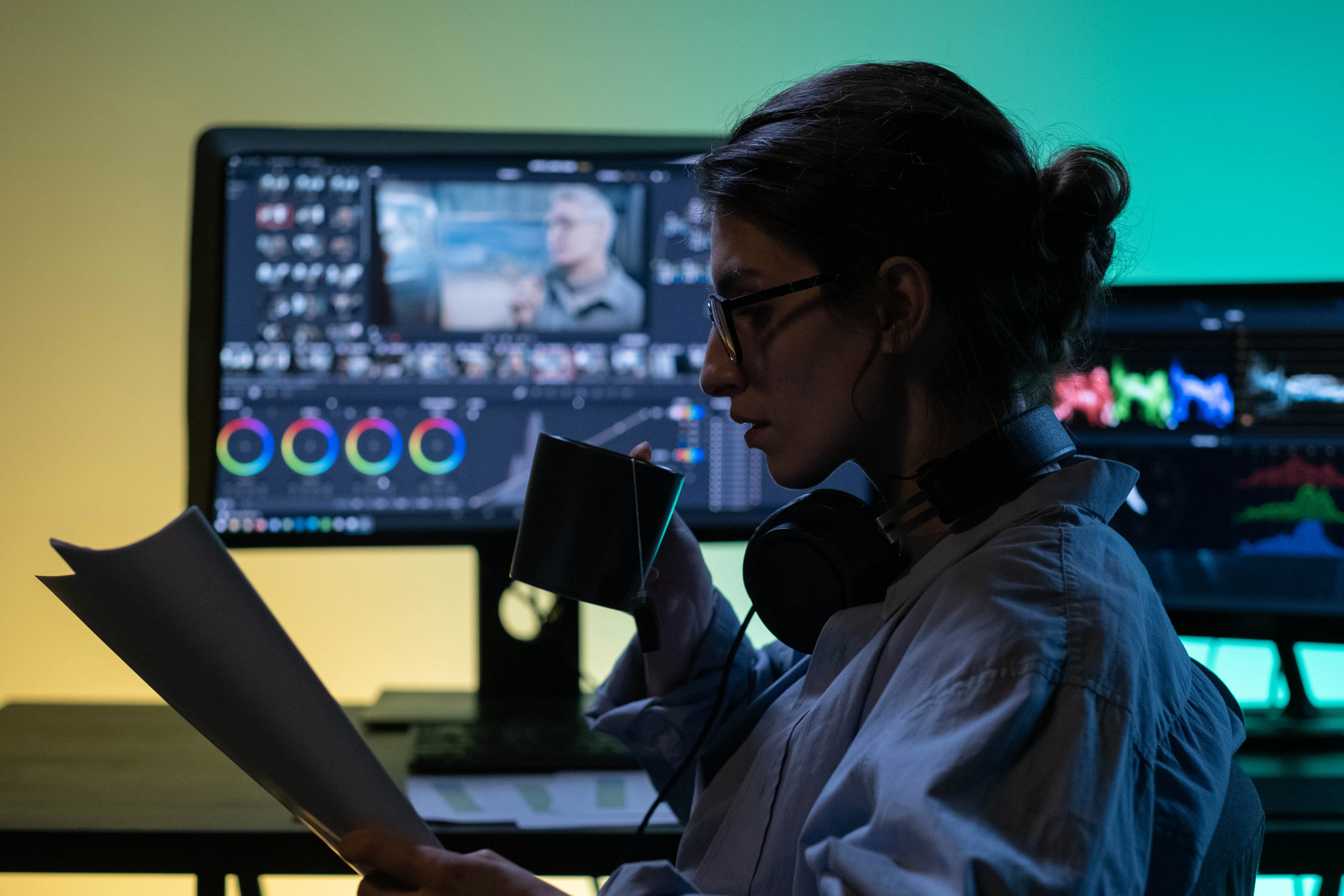 A creative professional comparing AI vs human writers while editing video content.