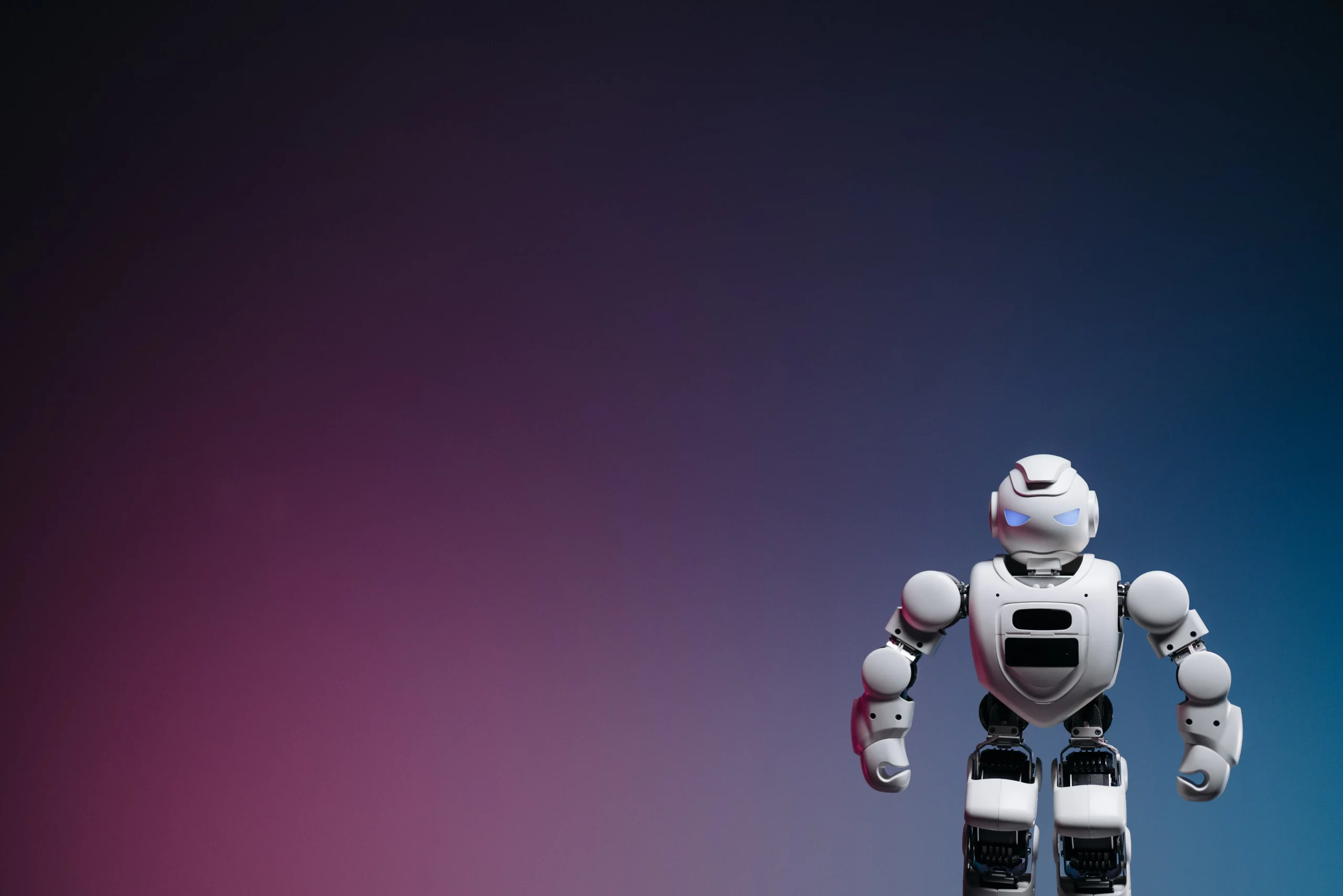 A white robot stands against a gradient background, representing risks of an AI article generator.