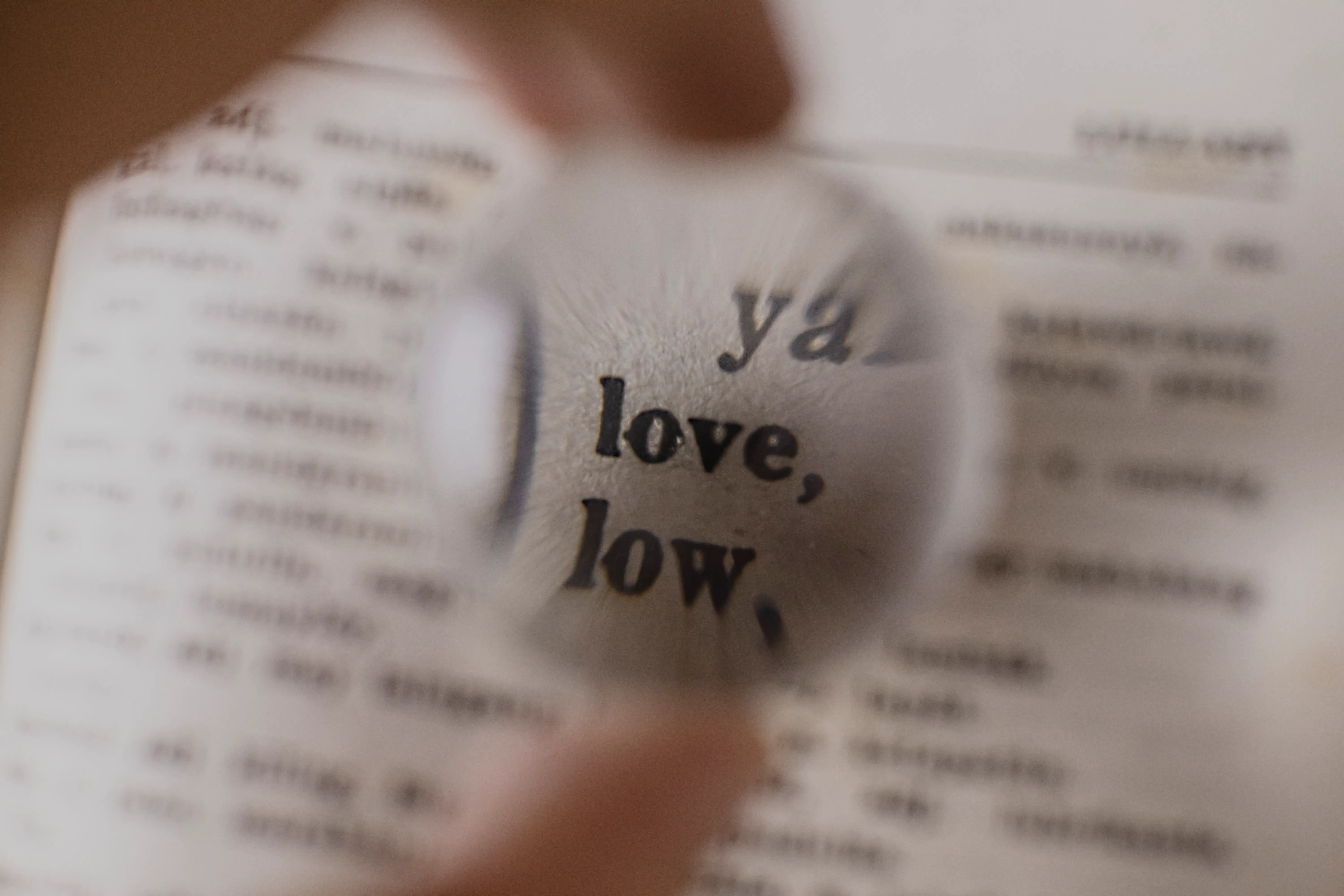 A magnifying glass focusing on text, representing careful analysis of high quality AI content.