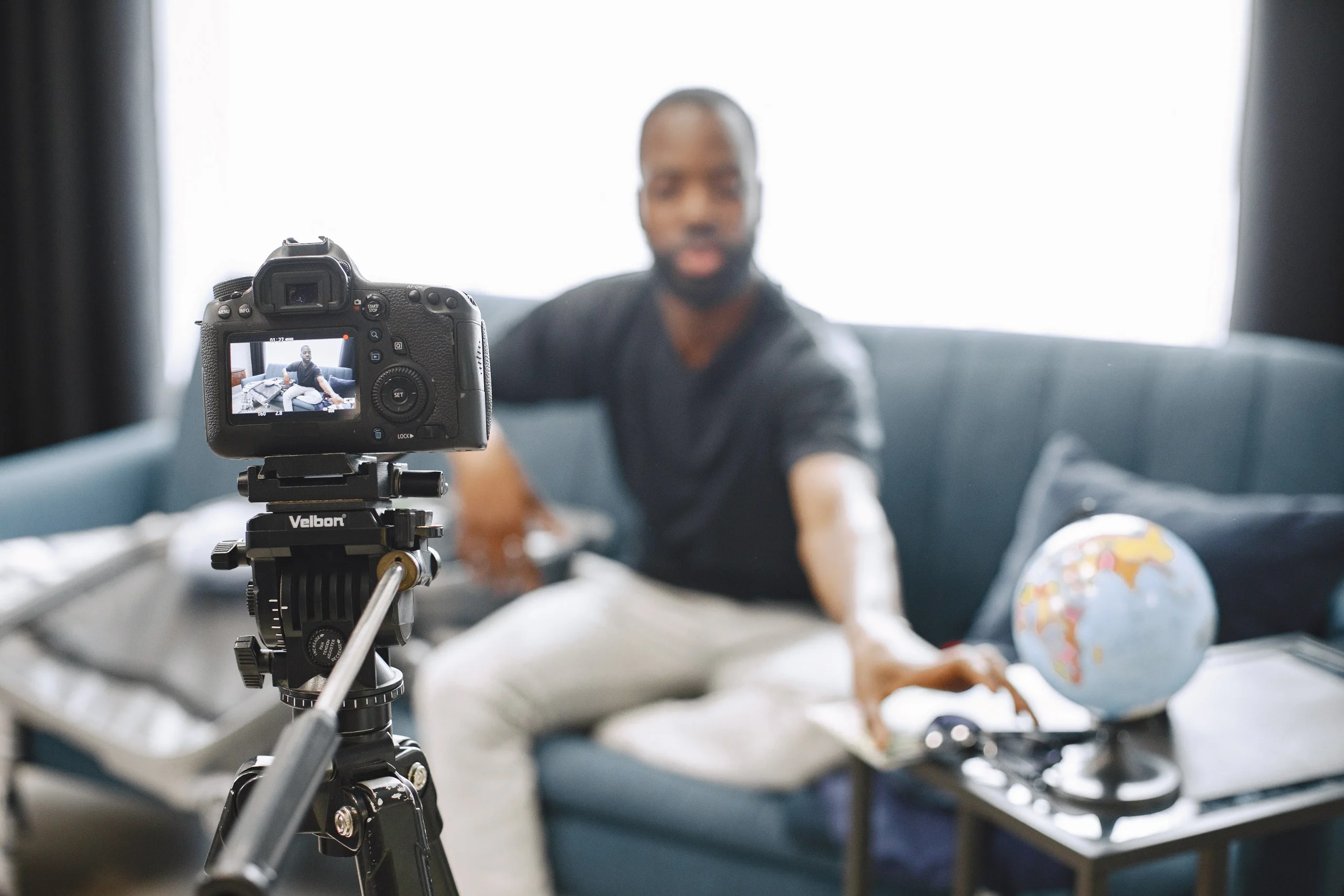 A content creator filming a video, illustrating the need for an AI SEO article writer tool.