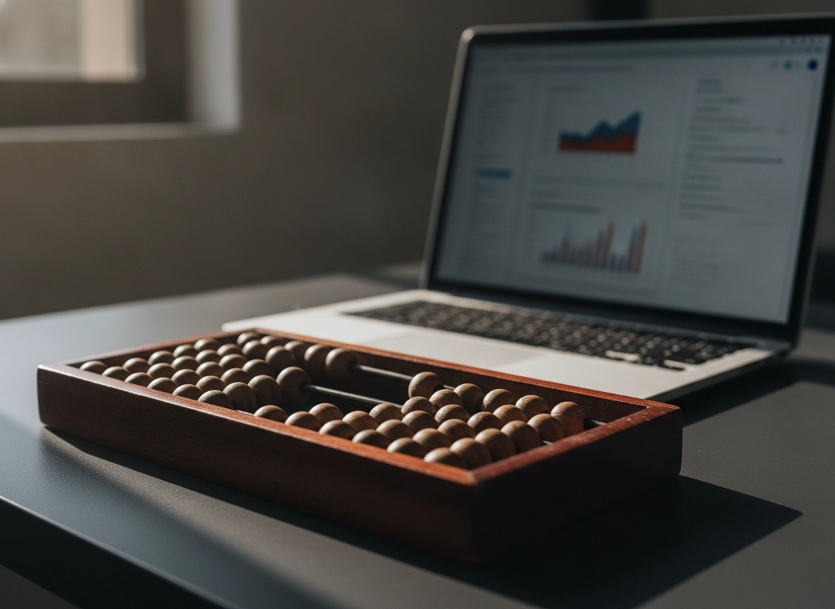 An abacus next to a laptop showing analytics, representing the calculation of seo optimization cost.