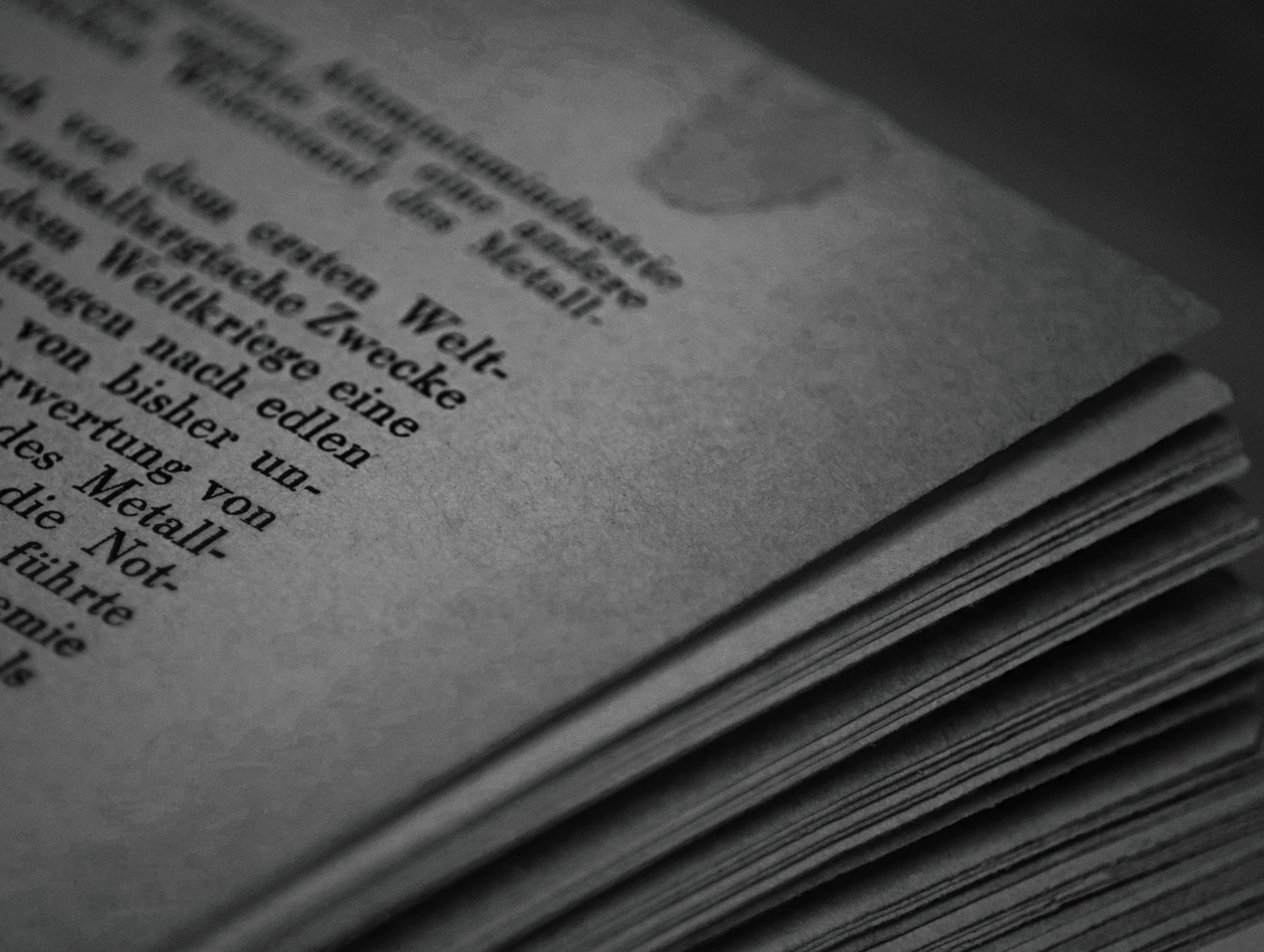 Close-up of book pages representing manual research vs ai content optimization tools.