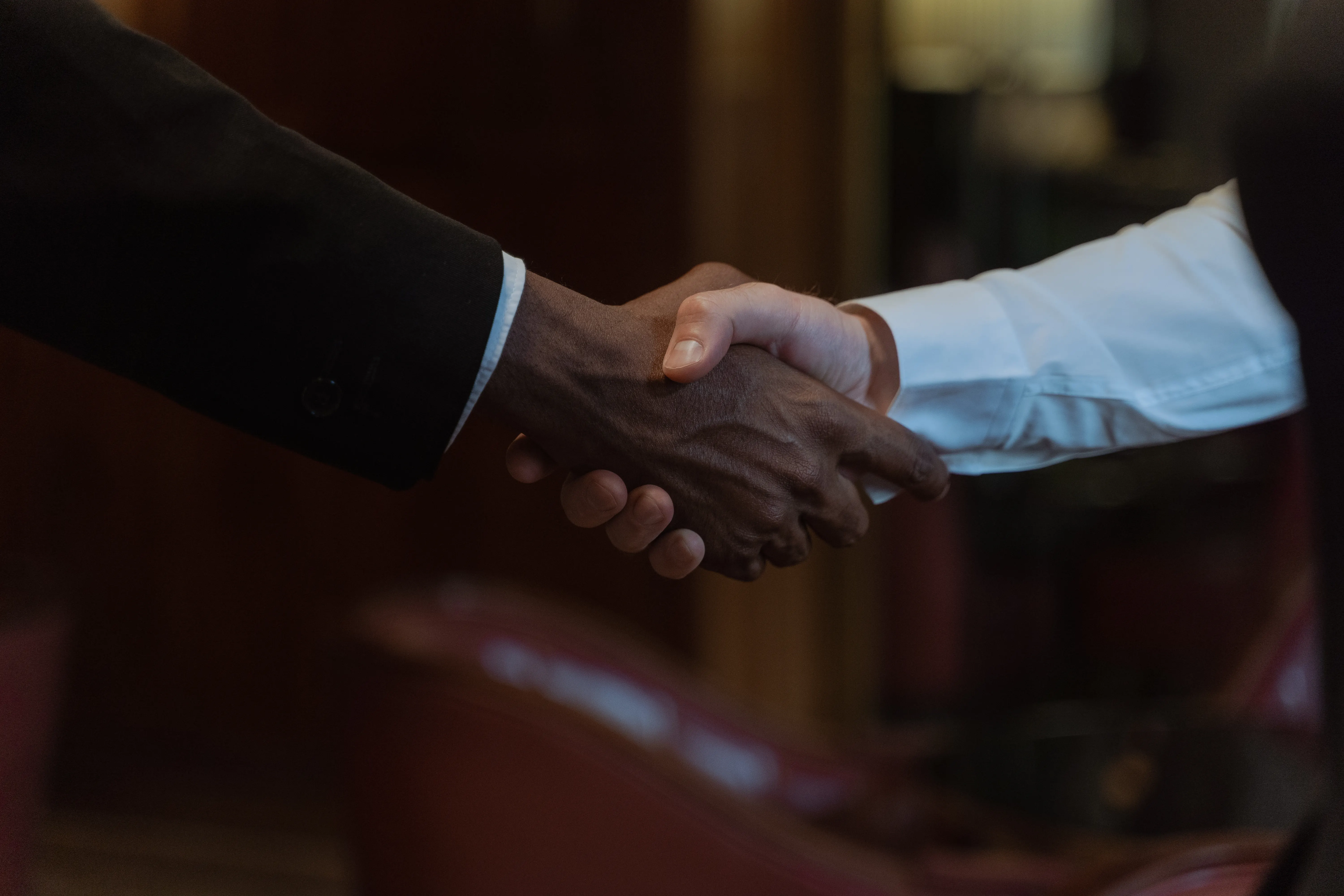 Professional handshake symbolizing an ai driven search strategy for higher rankings.