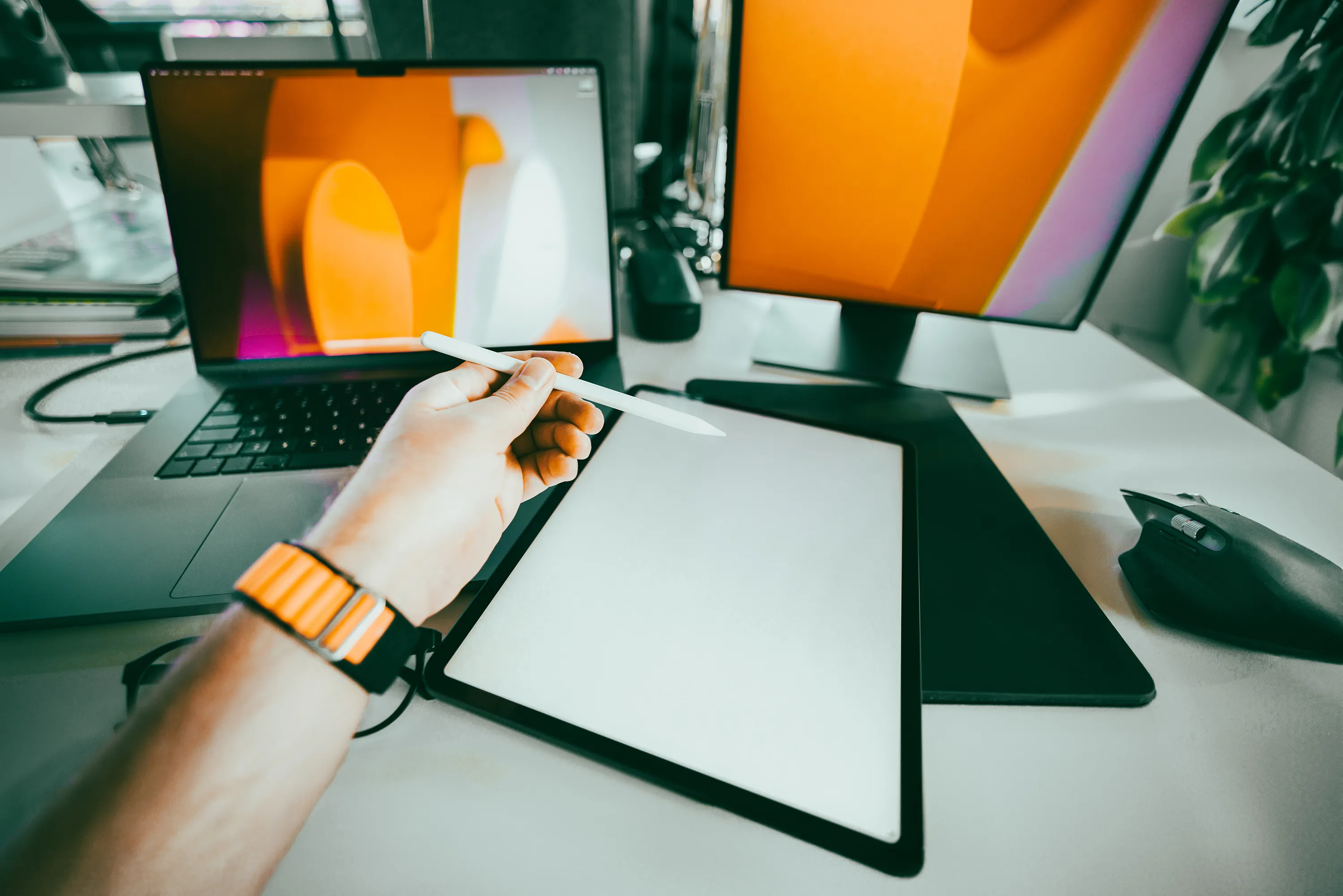 A person holding a stylus over a tablet, demonstrating an automated content workflow with AI SEO strategy India.