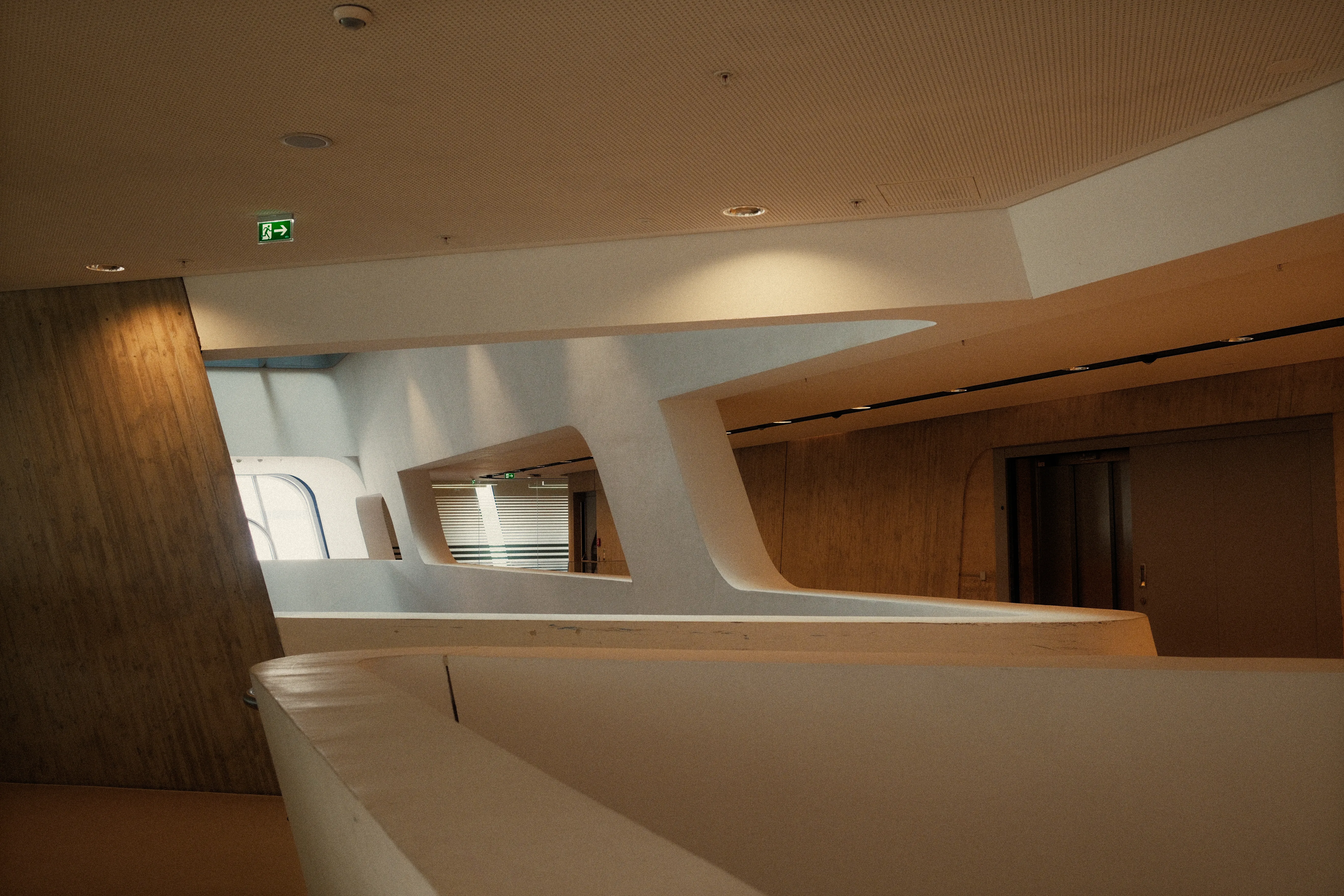 A modern architectural interior with curved white walls, demonstrating structured online ai seo tool layouts.
