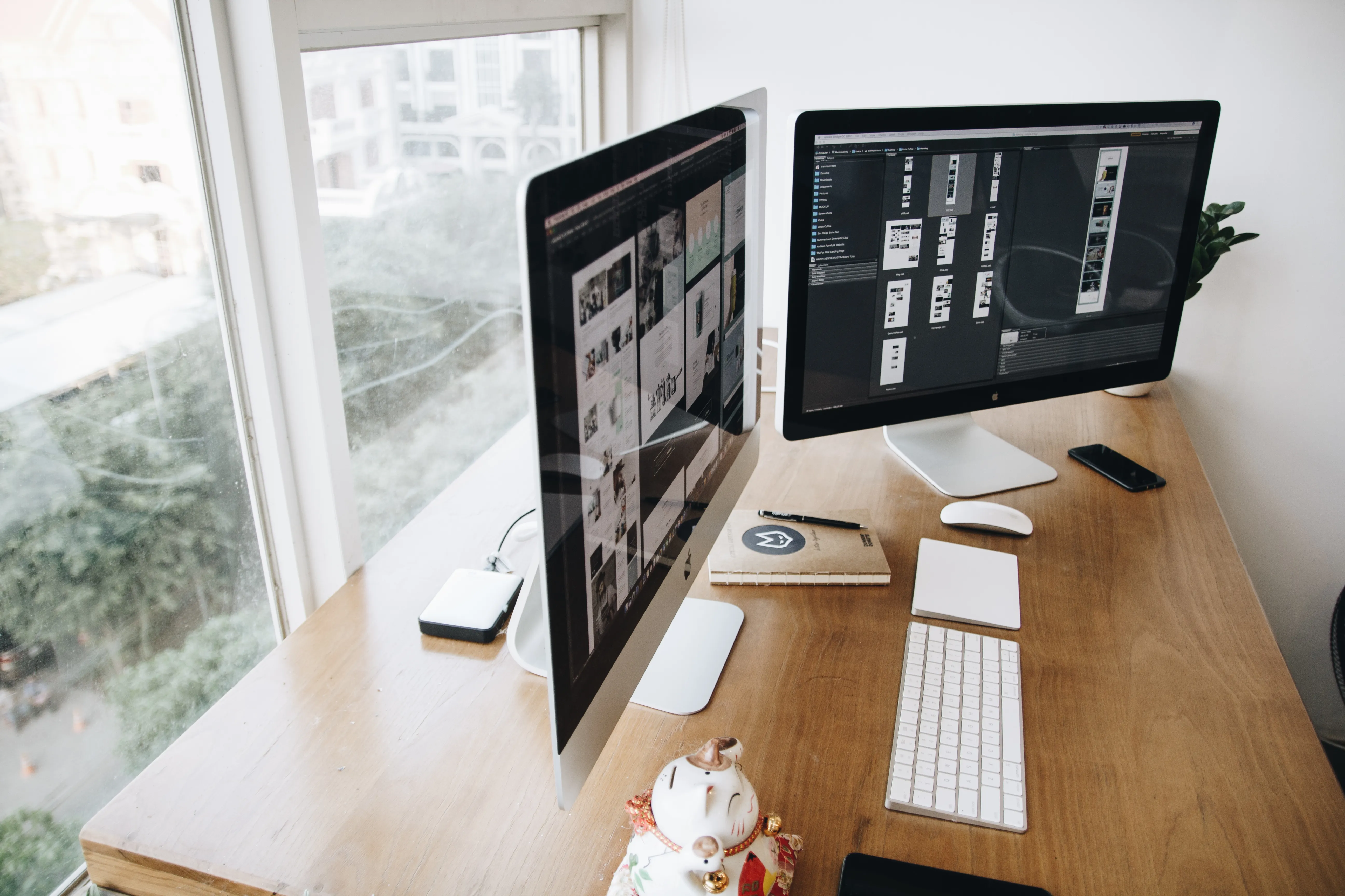 Dual monitor workstation showing website layouts to optimize content for ChatGPT and AI search.