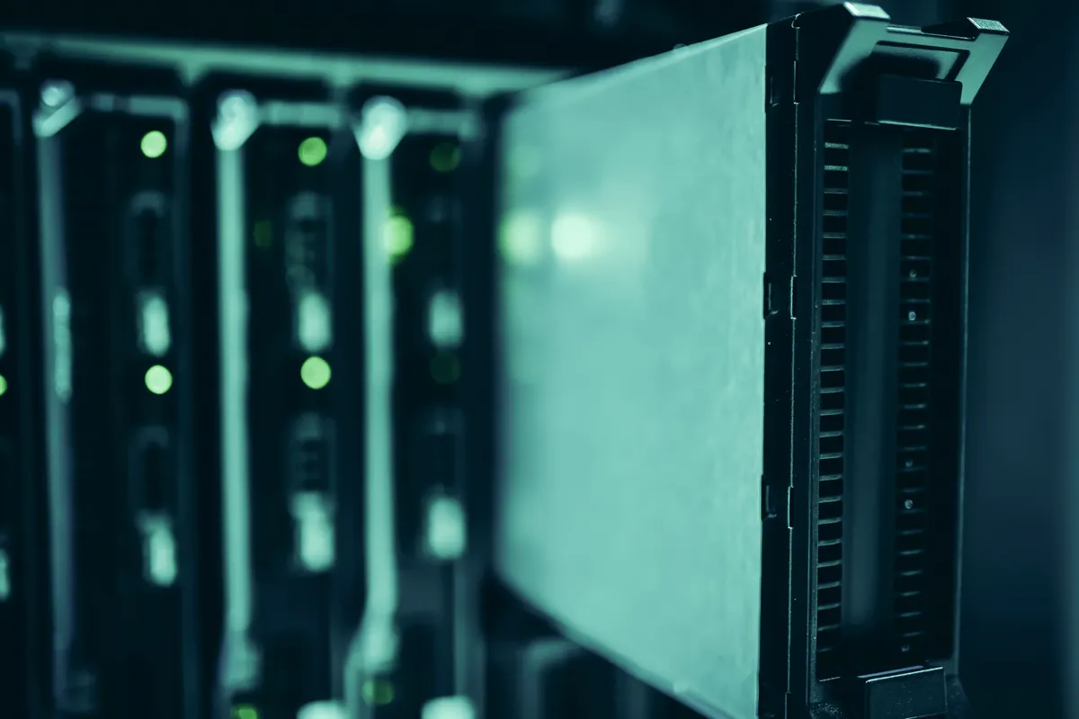 Server rack with glowing lights representing infrastructure for AI answer engines SEO and data processing.