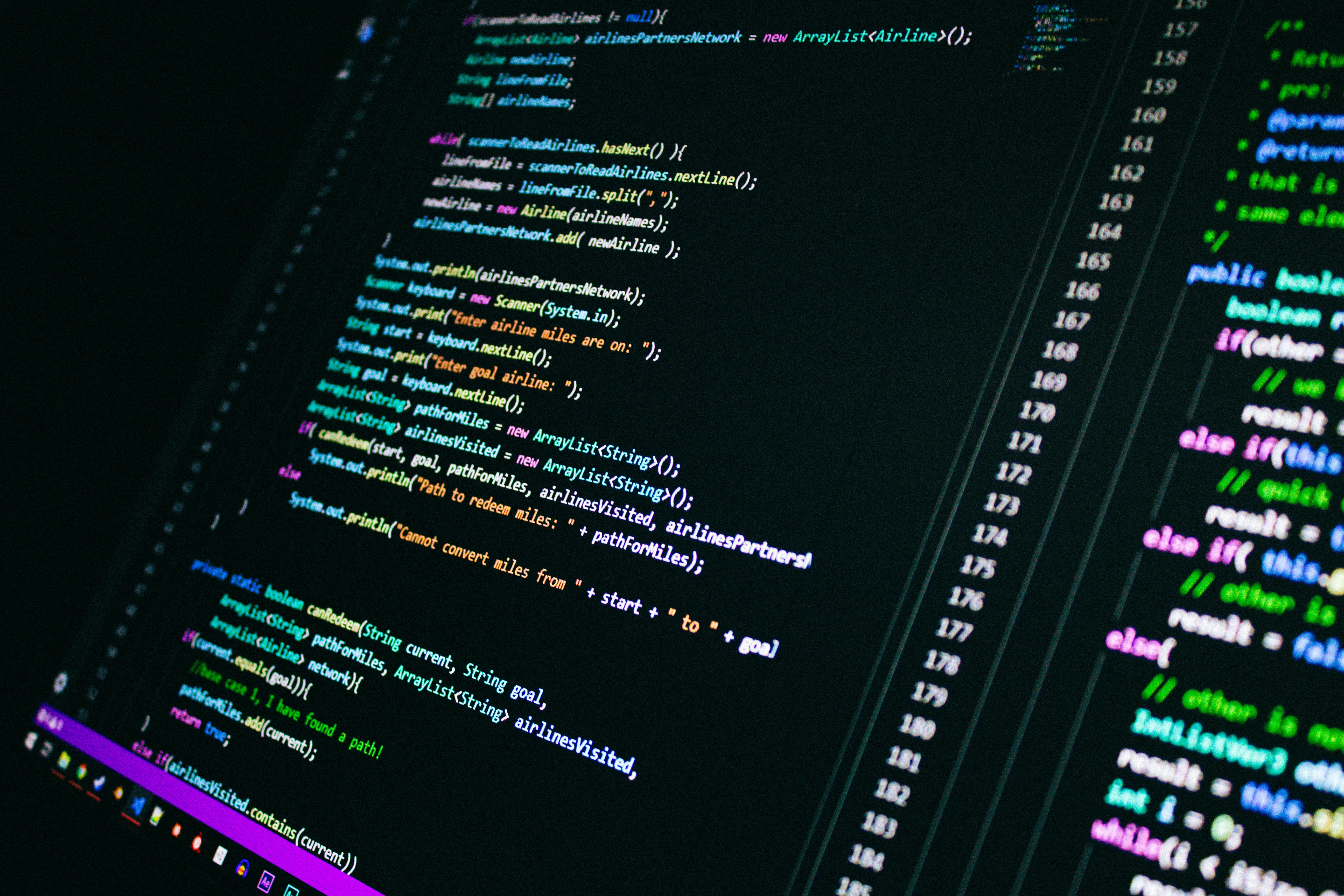 Computer screen showing lines of code for ai answer engine optimization to improve site visibility.