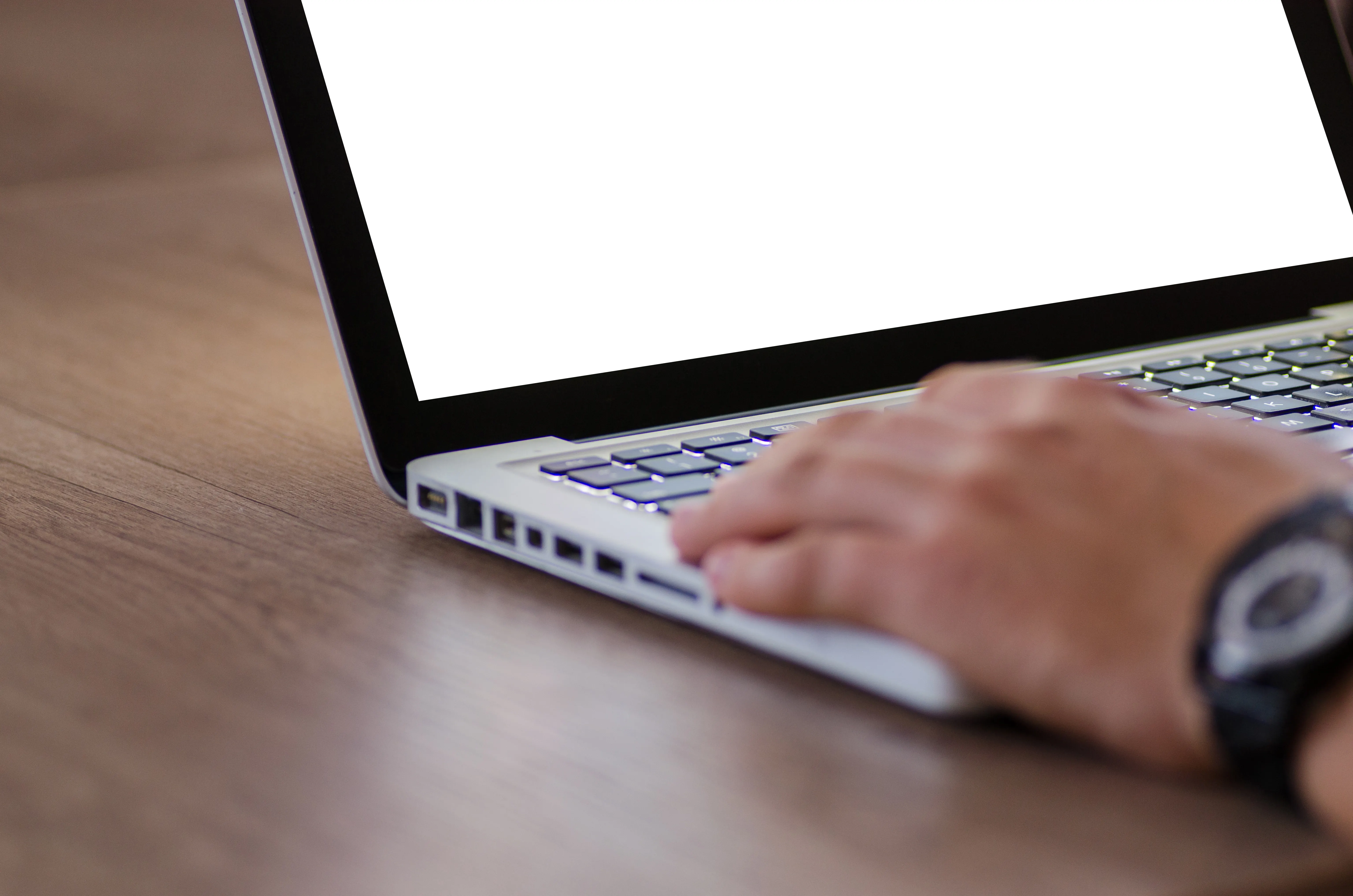 Close-up of hands typing on a laptop to learn how to optimize for ChatGPT and conversational search.