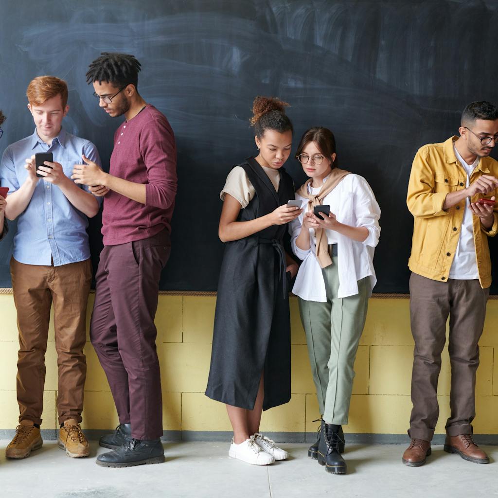 A visually engaging thumbnail showing a diverse group of people enthusiastically interacting with content displayed on various digital devices, with an AI brain subtly integrated into the background to symbolize the fusion of human creativity and artificial intelligence. The color scheme should be modern and vibrant, conveying excitement and innovation.