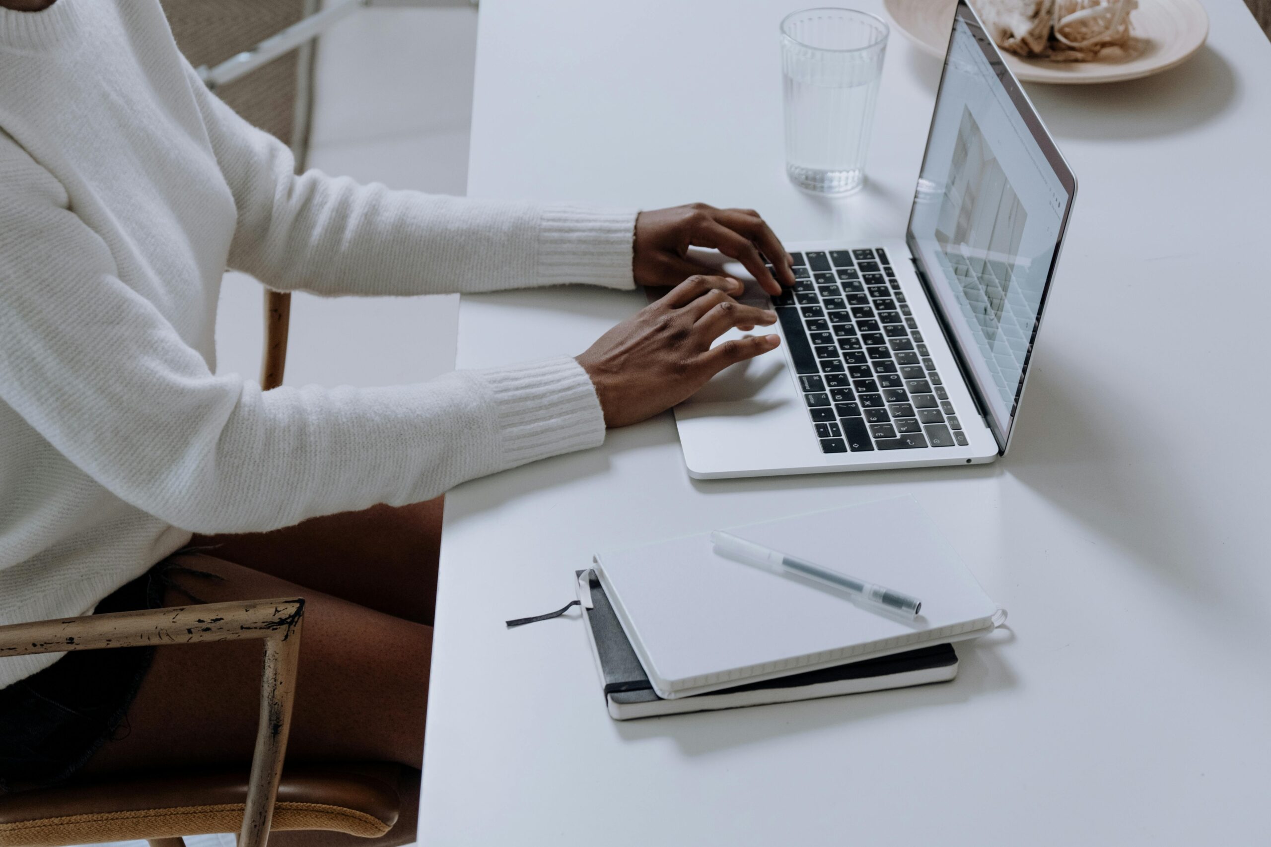 A split-screen showing the evolution of blogging: on one side, a vintage typewriter representing traditional methods; on the other side, a modern laptop displaying AI-powered writing tools.