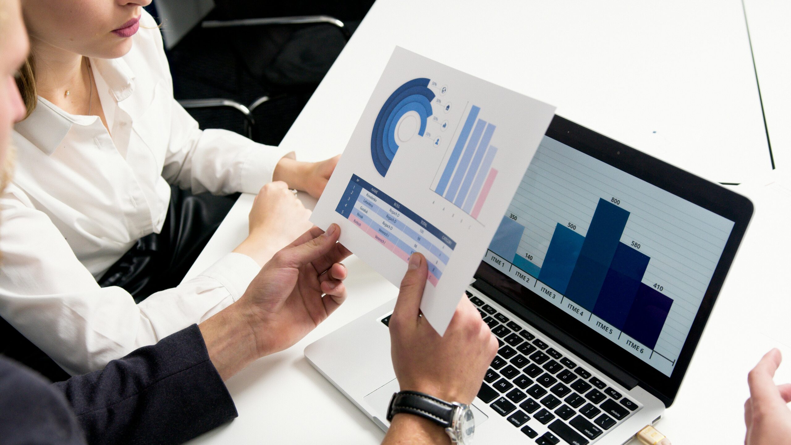 A person confidently standing in front of a screen displaying AI-driven SEO results, symbolizing empowerment and success. The background shows a thriving business environment with upward-trending graphs.