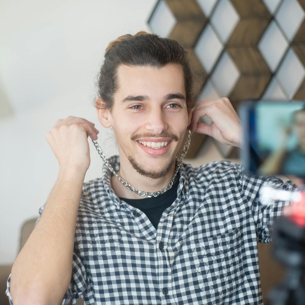 A person smiling and enthusiastically writing a blog post on a laptop, surrounded by AI icons and positive feedback symbols like hearts and thumbs up.
